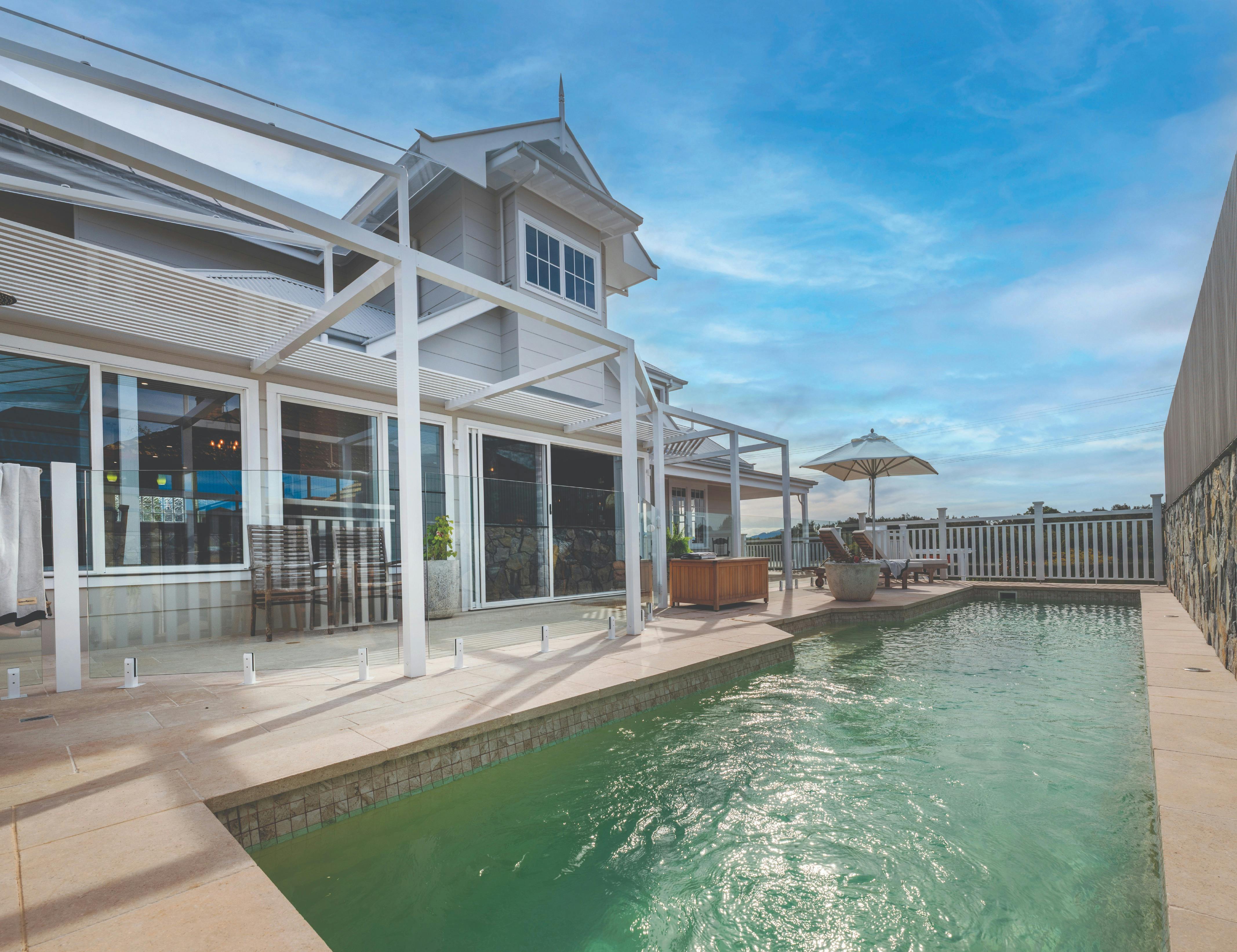 Pool heating, luxurious steamer chairs and an outdoor hot & cold shower give resort-style experience