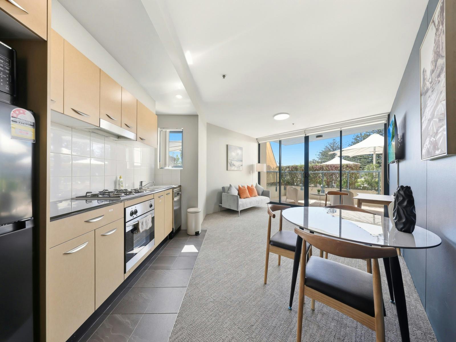 Modern kitchen with dining and balcony view