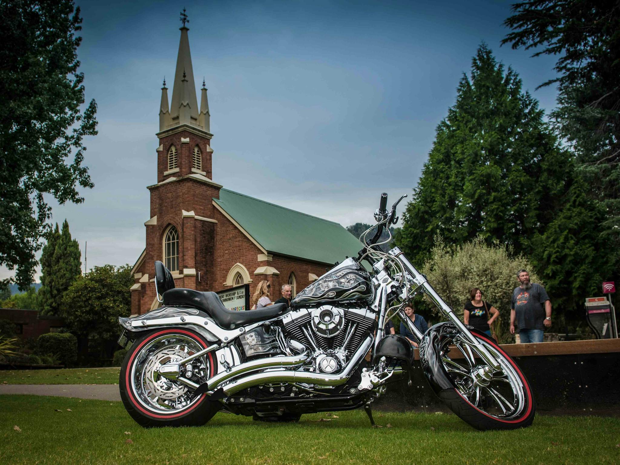 Harley parked in front of the church in the Main Street of Bright