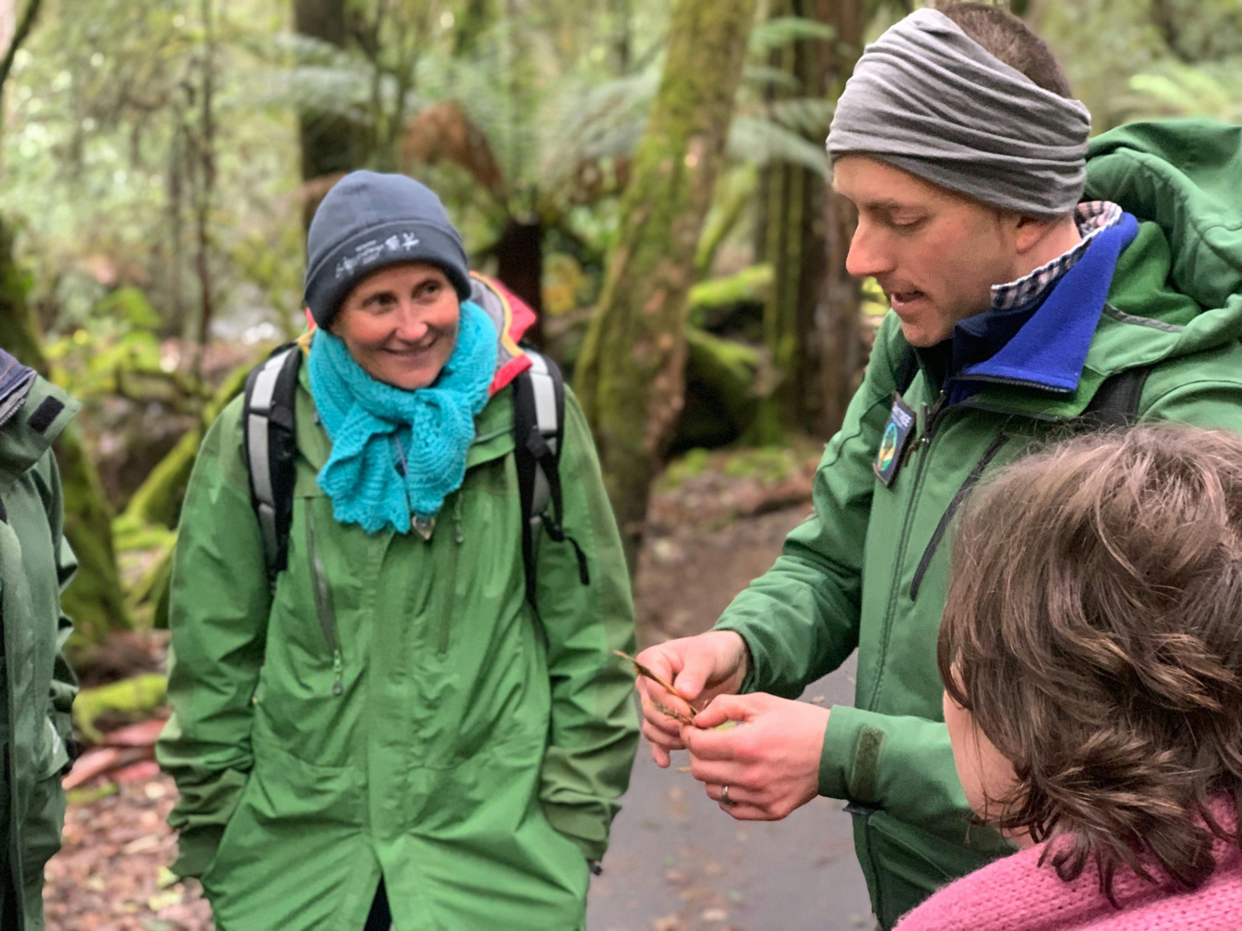 Guests enjoying an ecology demonstration amongst the giant trees at Mount Field