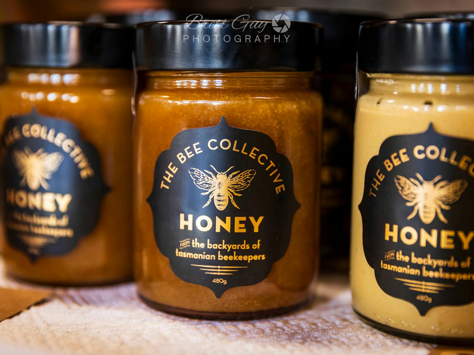 jars of honey with the label The Bee Collective