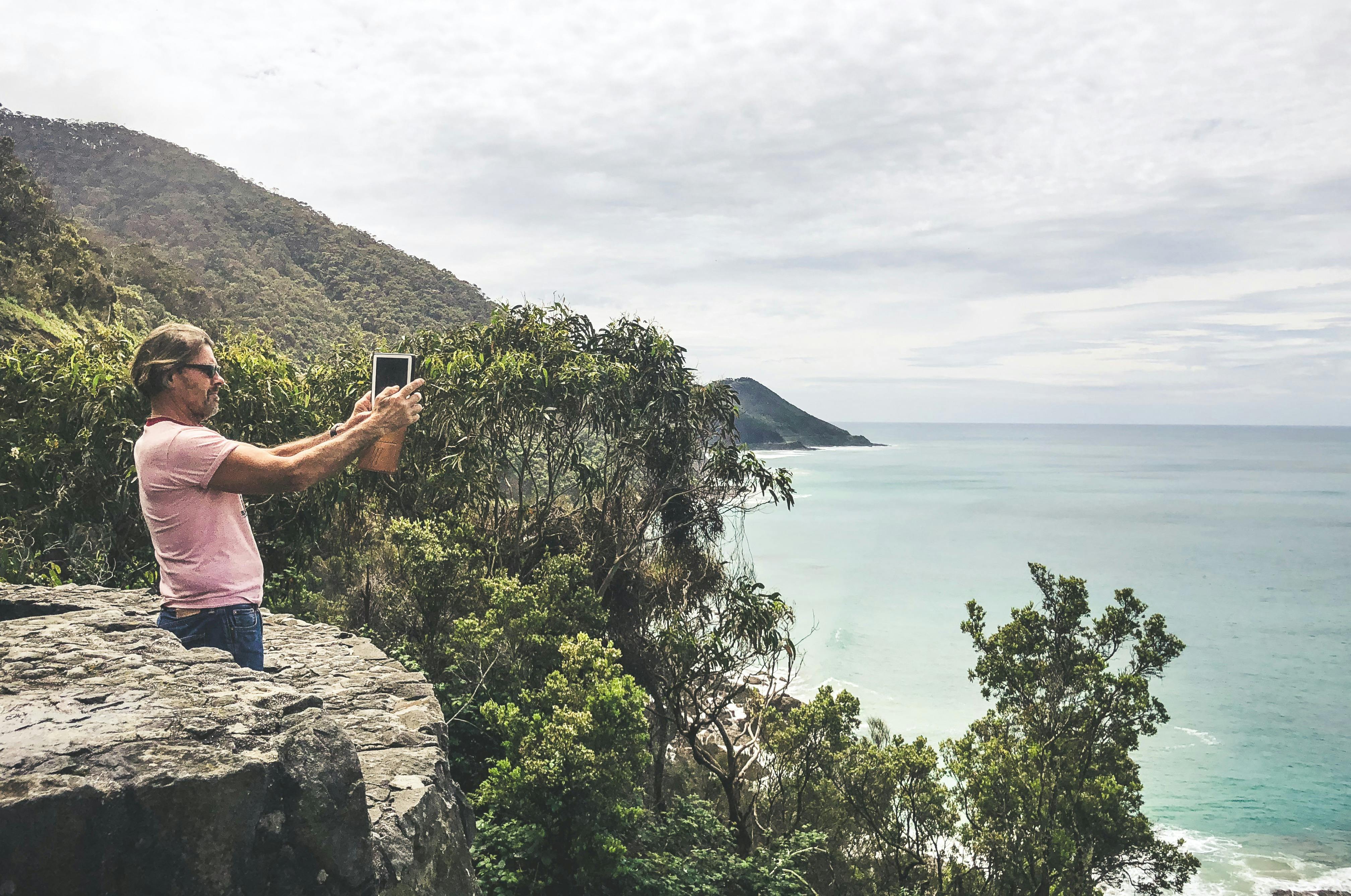 Man takes photo of the ocean
