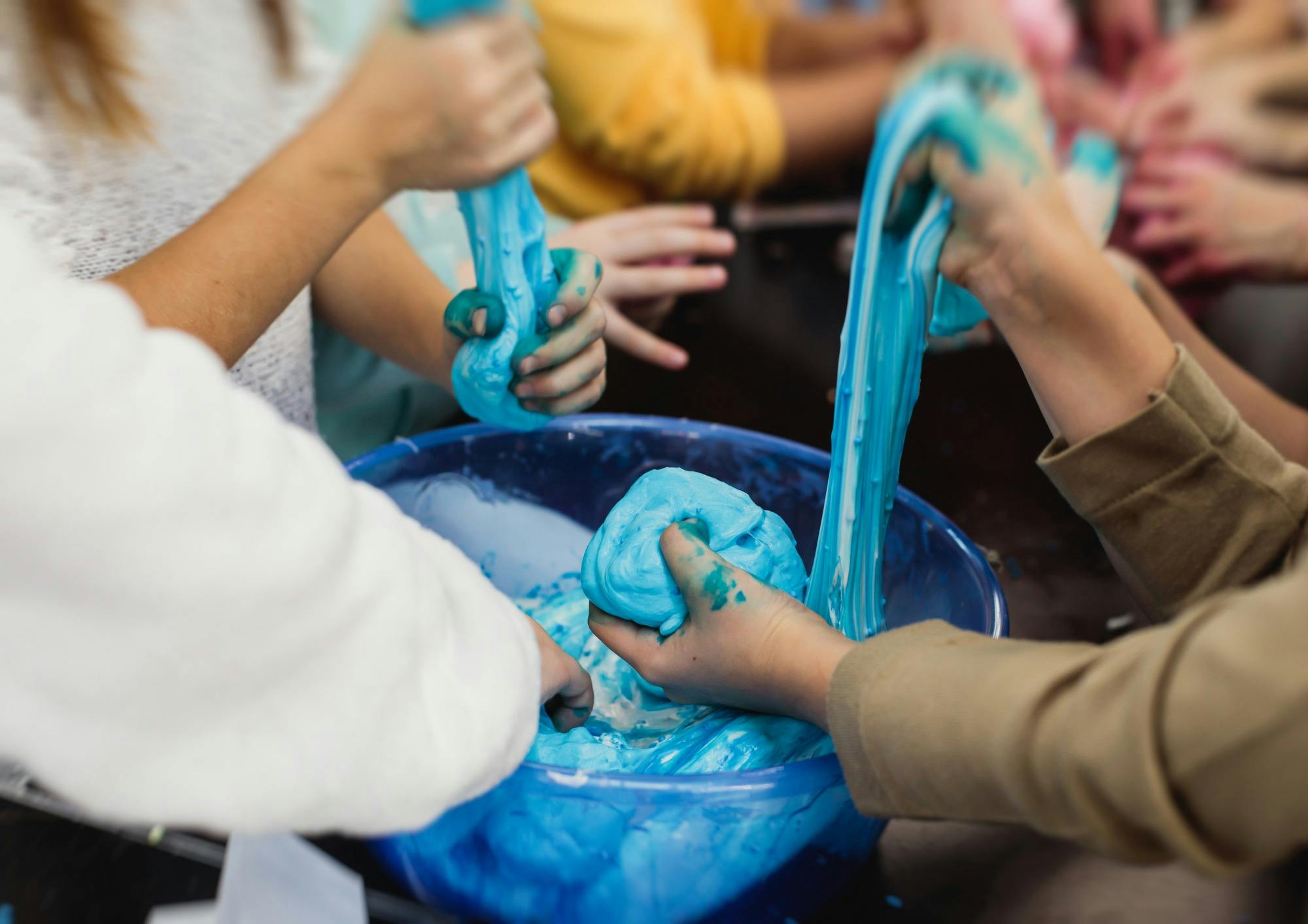 Kids making blue slime