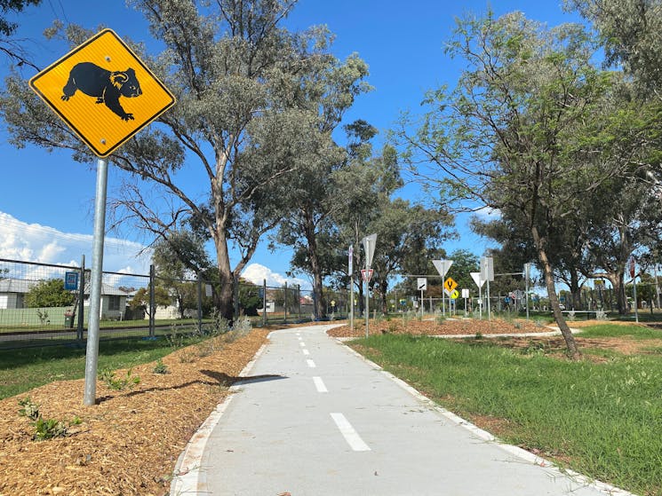 Koala crossing sign on bike path