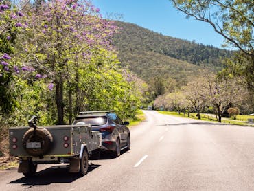 Car and campervan driving along a country road Car and campervan driving along a country road