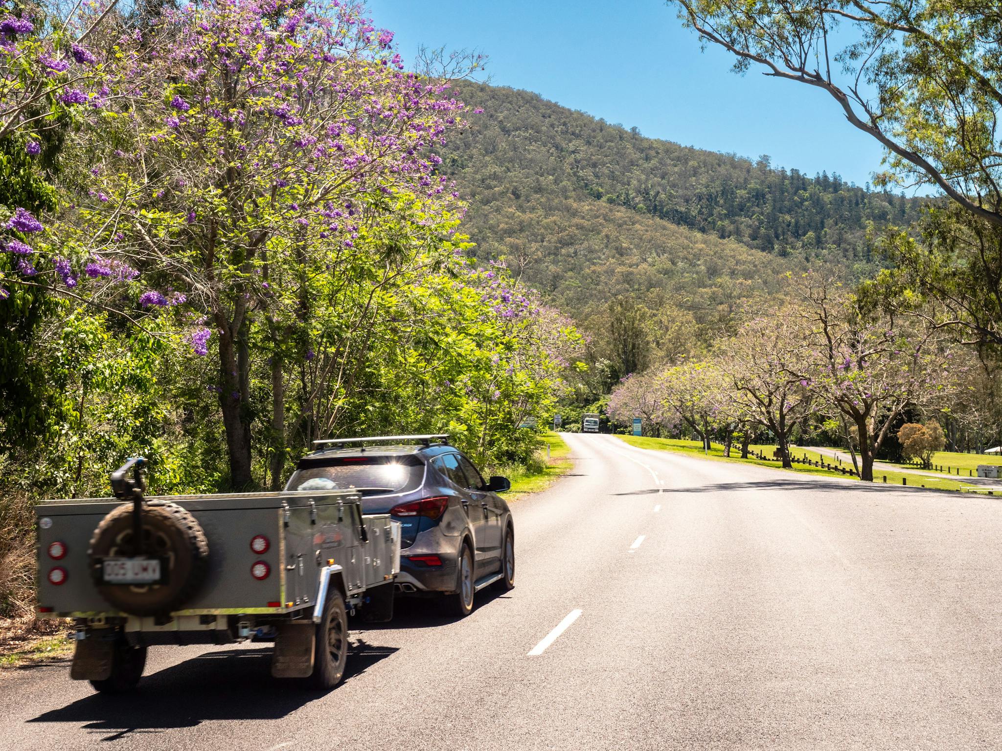 Car and campervan driving along a country road Car and campervan driving along a country road