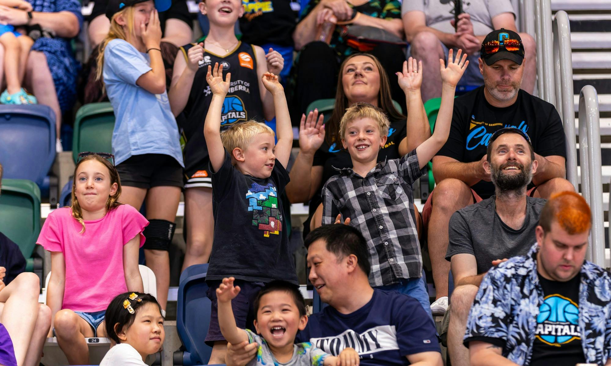 UC Capitals fans cheering in the crowd.