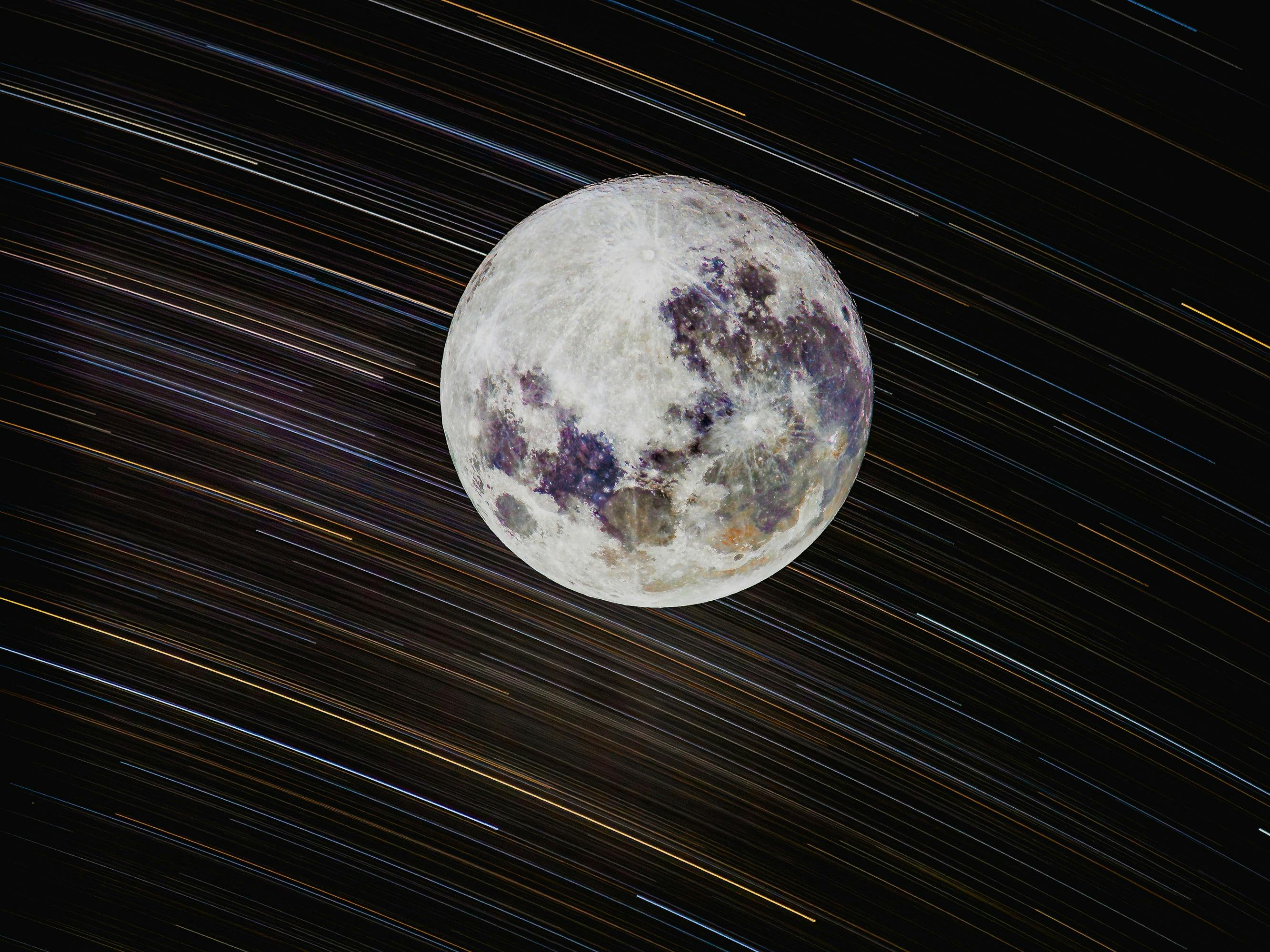 Moon detailed over startrail background