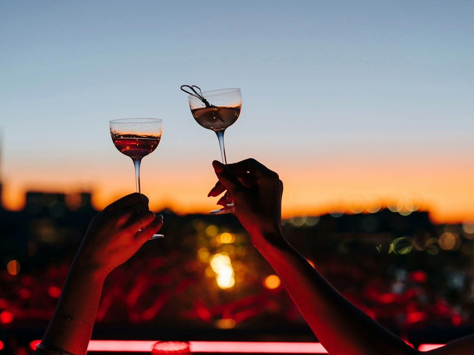 Hands holding up glasses