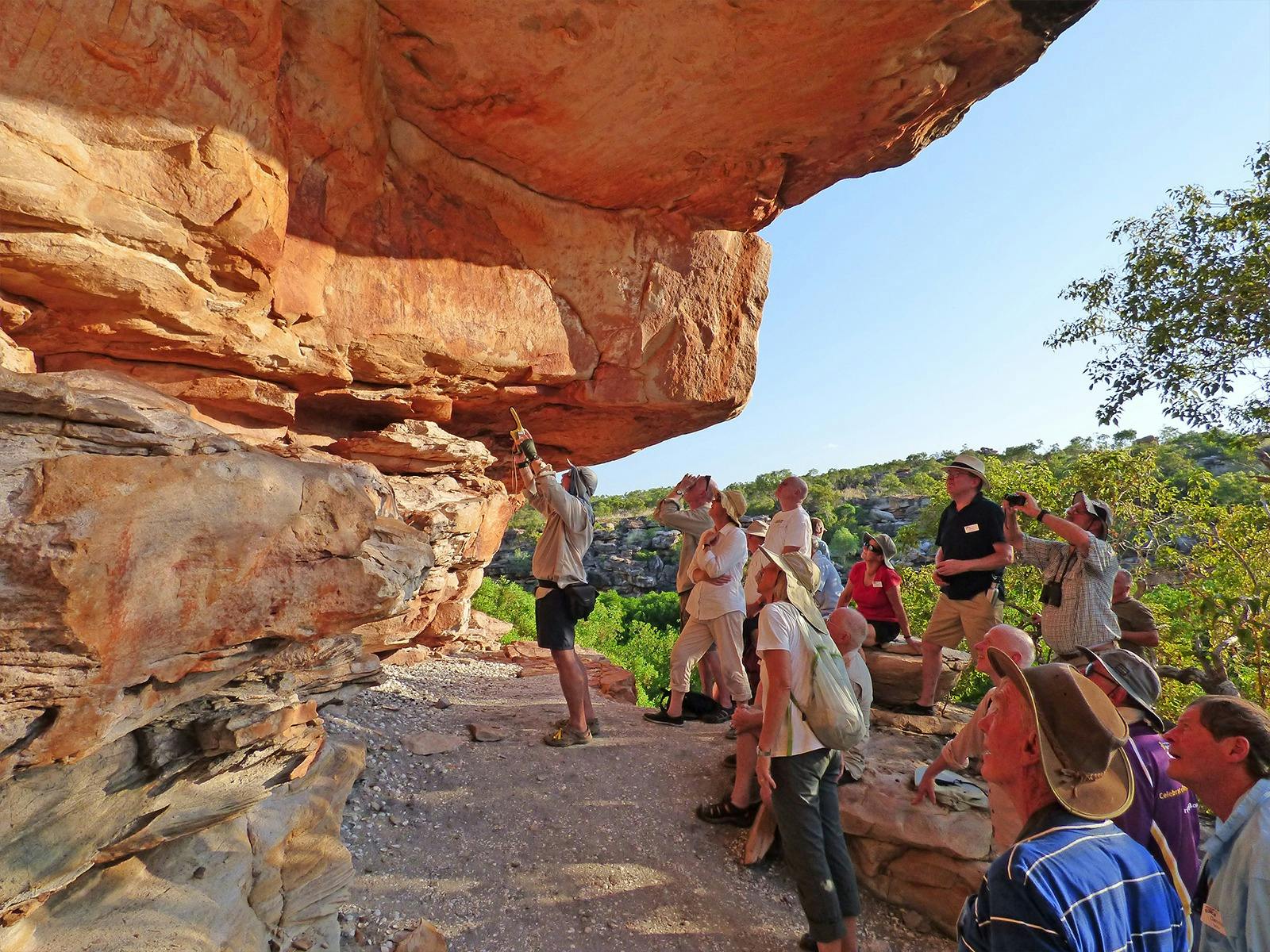 Guest Lecturer Showing Guests Ancient Rock Art At Swift Bay