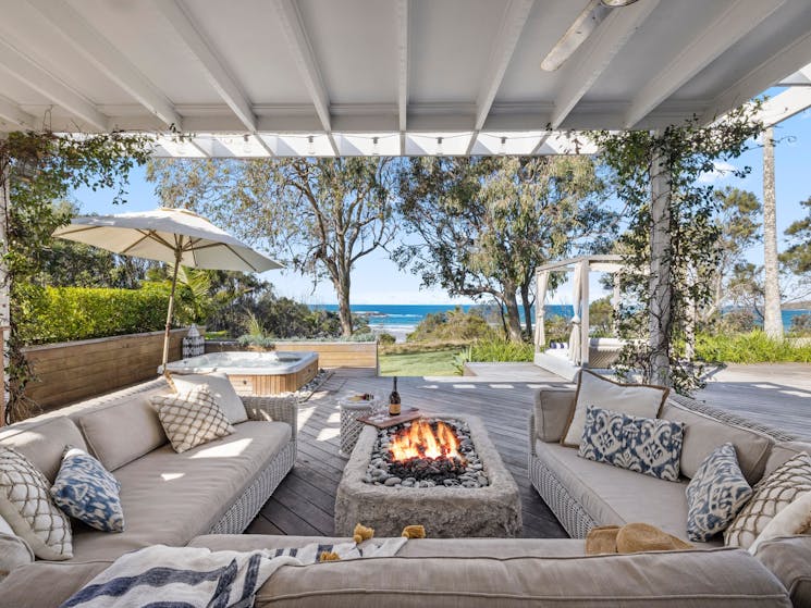 Outdoor seating with fire pit and lounge chairs