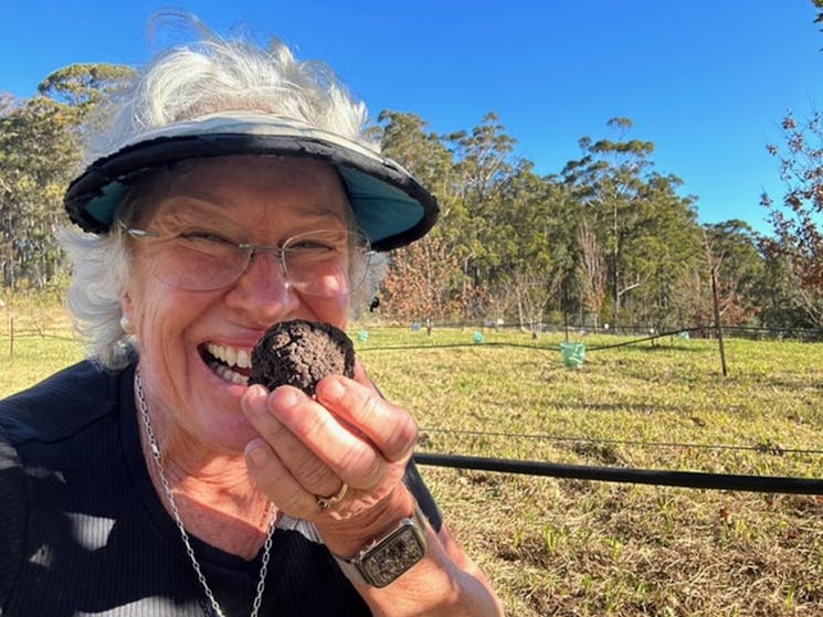 A broad smile as Joanne smells her truffle
