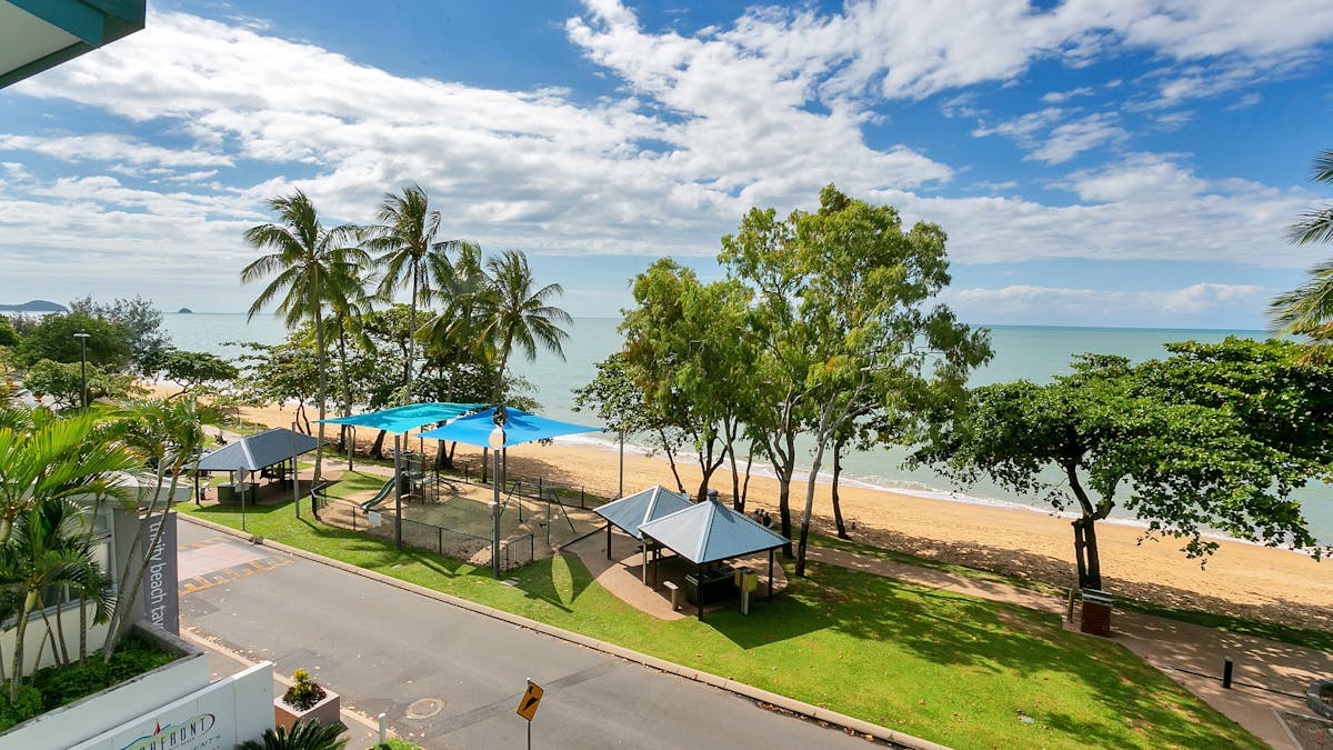 Trinity Beach is located in front of the building.ectly in fron of the