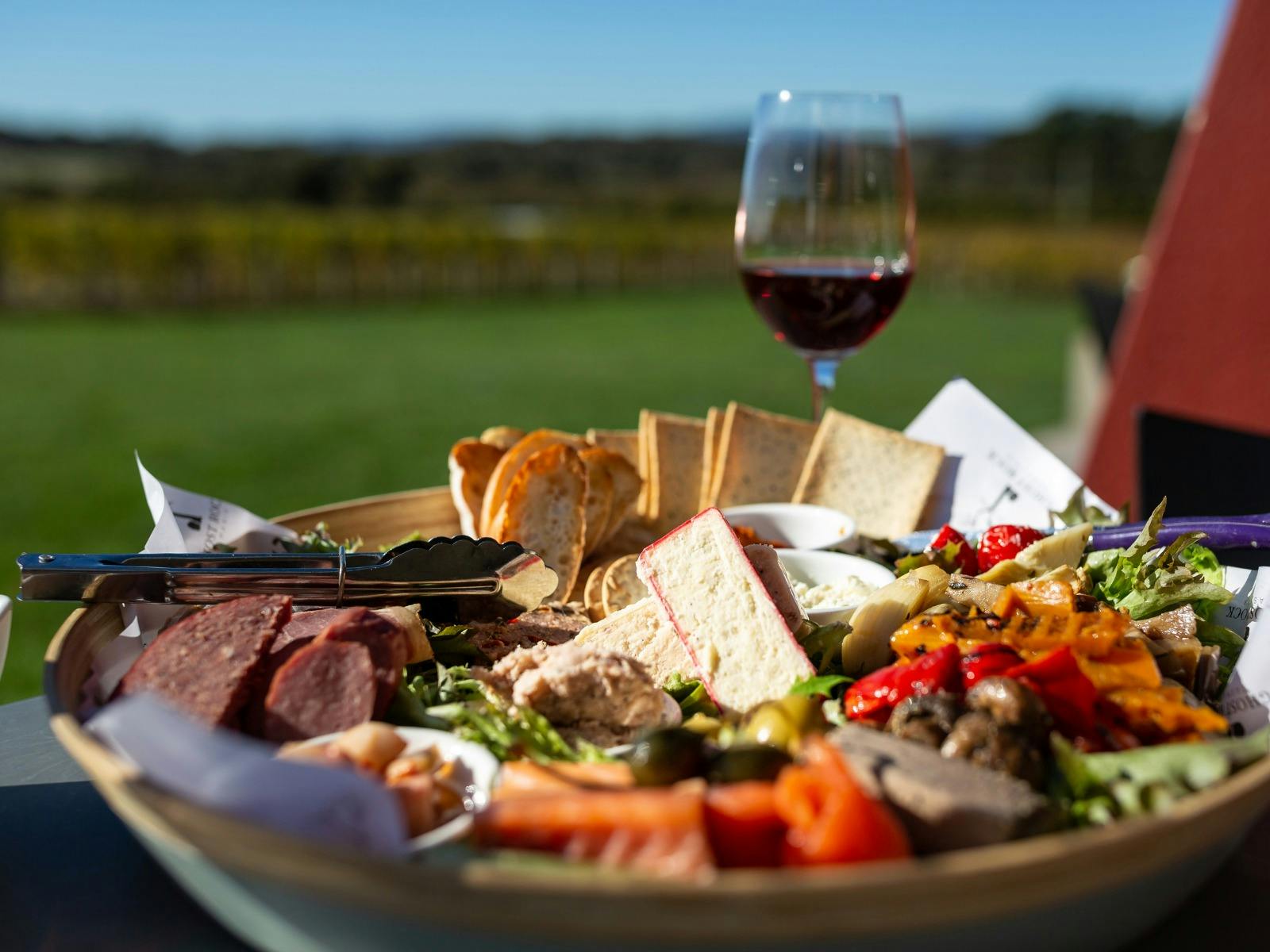 Indulge in a feast of food and wine, a delightful experience with Coastline Tours Tasmania