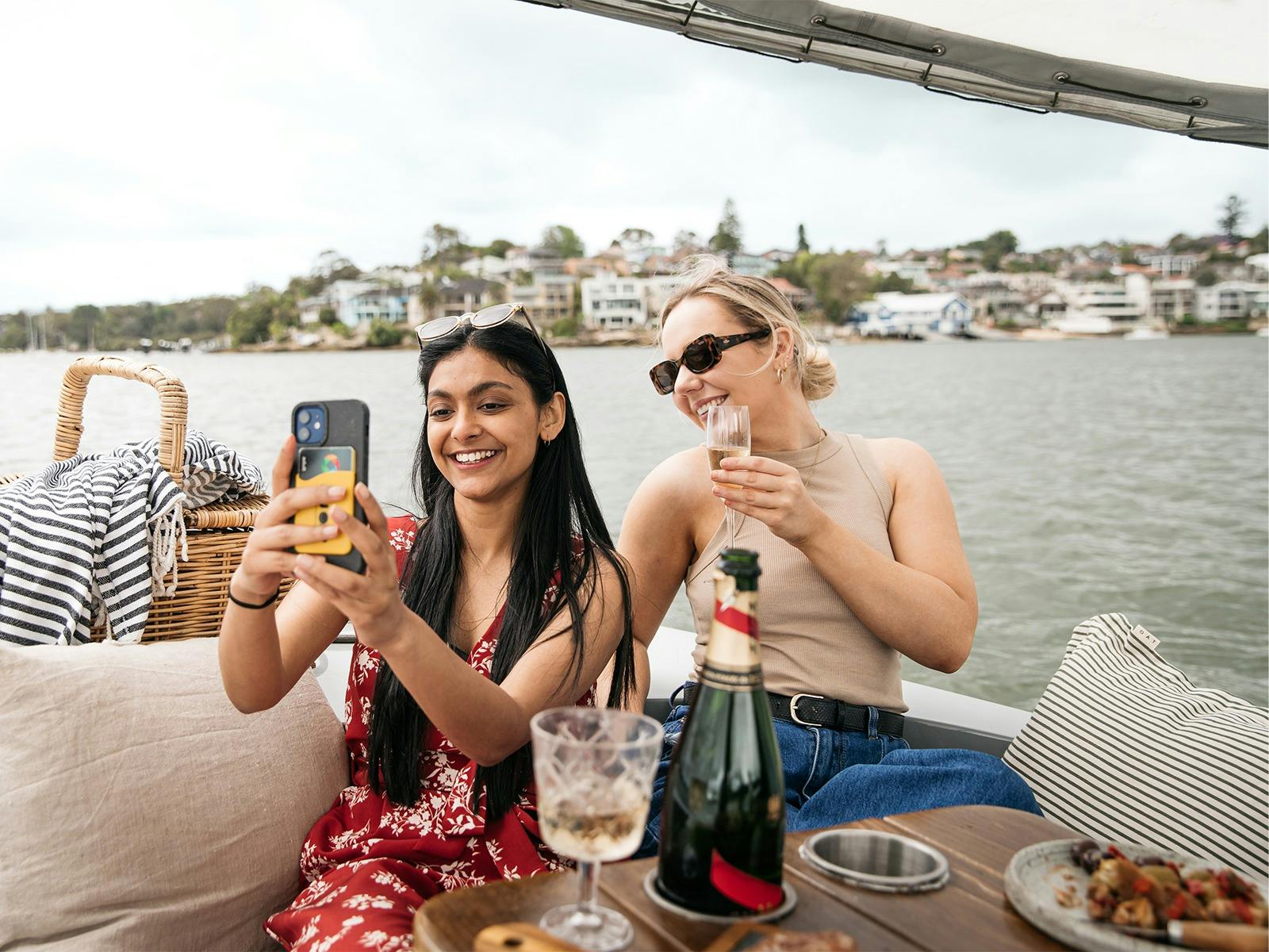 Two women take a selfie onboard a GoBoat Two women take a selfie onboard a GoBoat