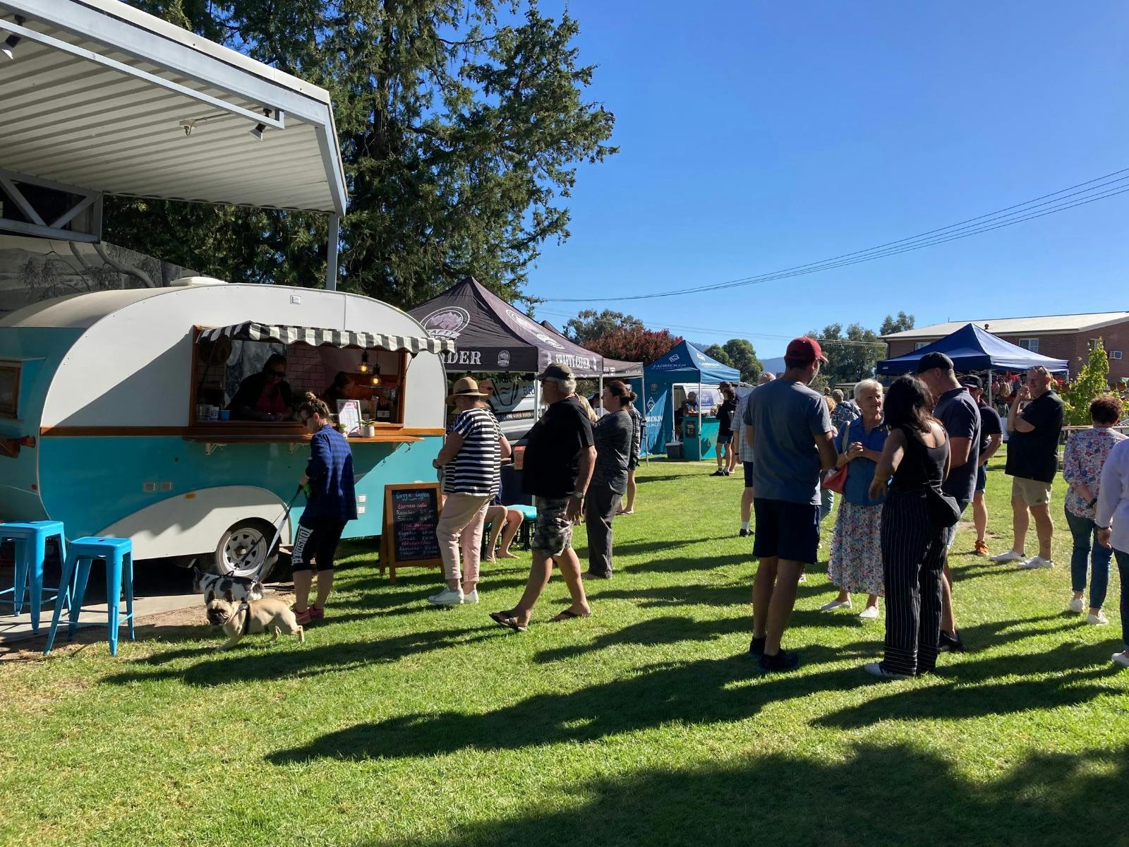 People lining up and waiting to be served from a caravan