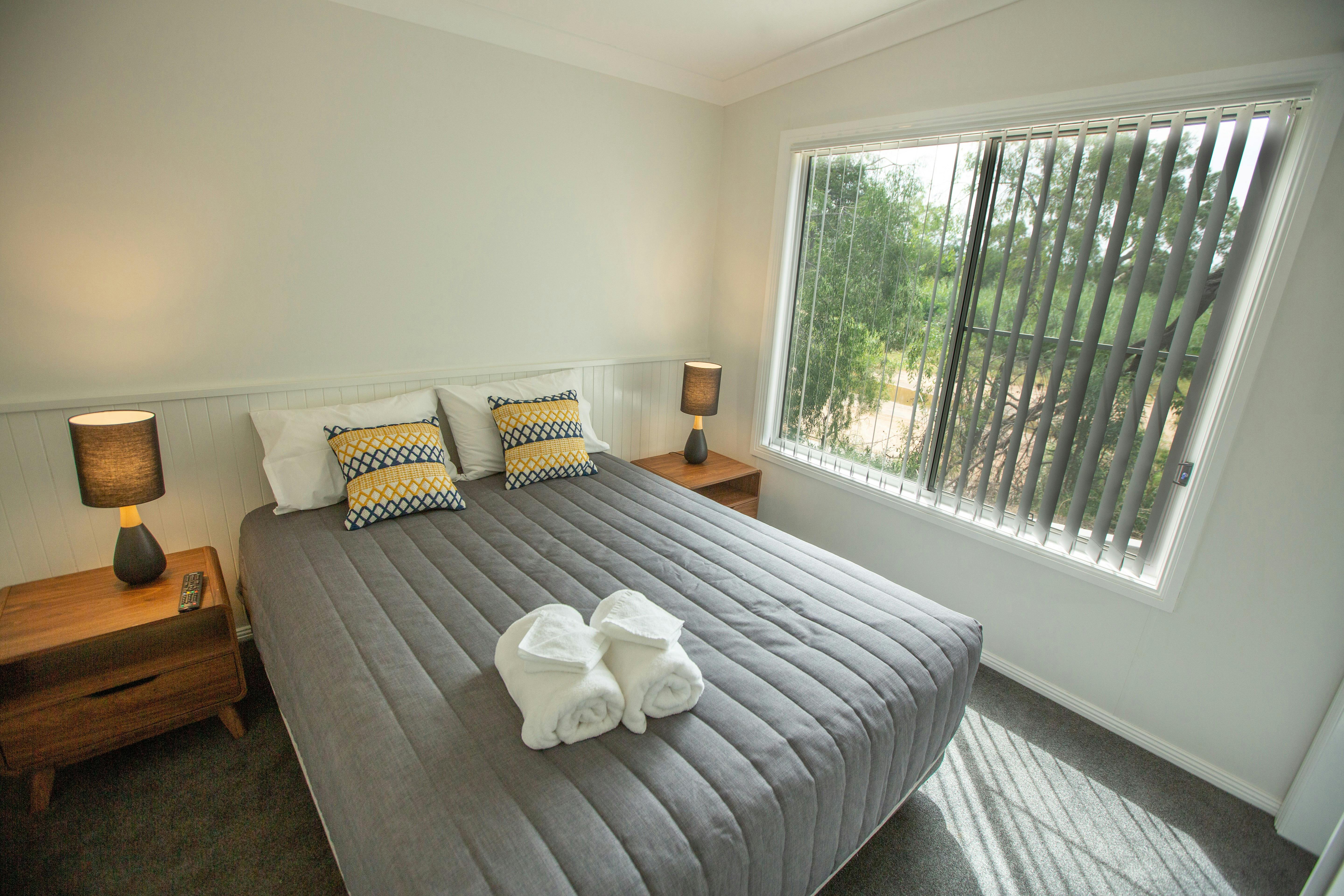Master bedroom in the Deluxe Cabins