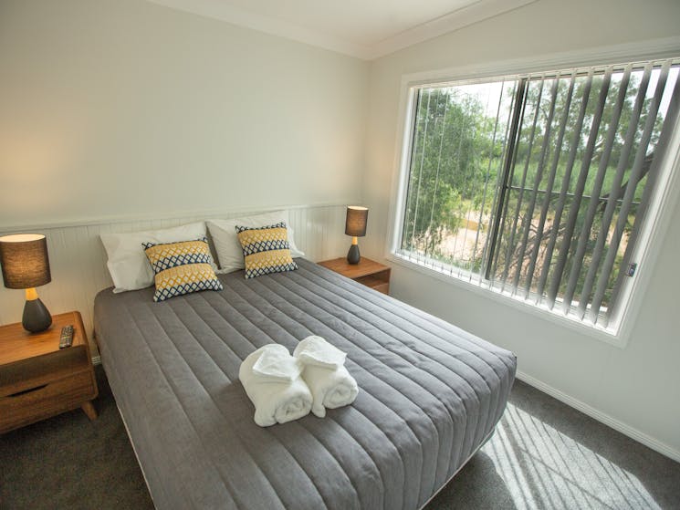 Master bedroom in the Deluxe Cabins