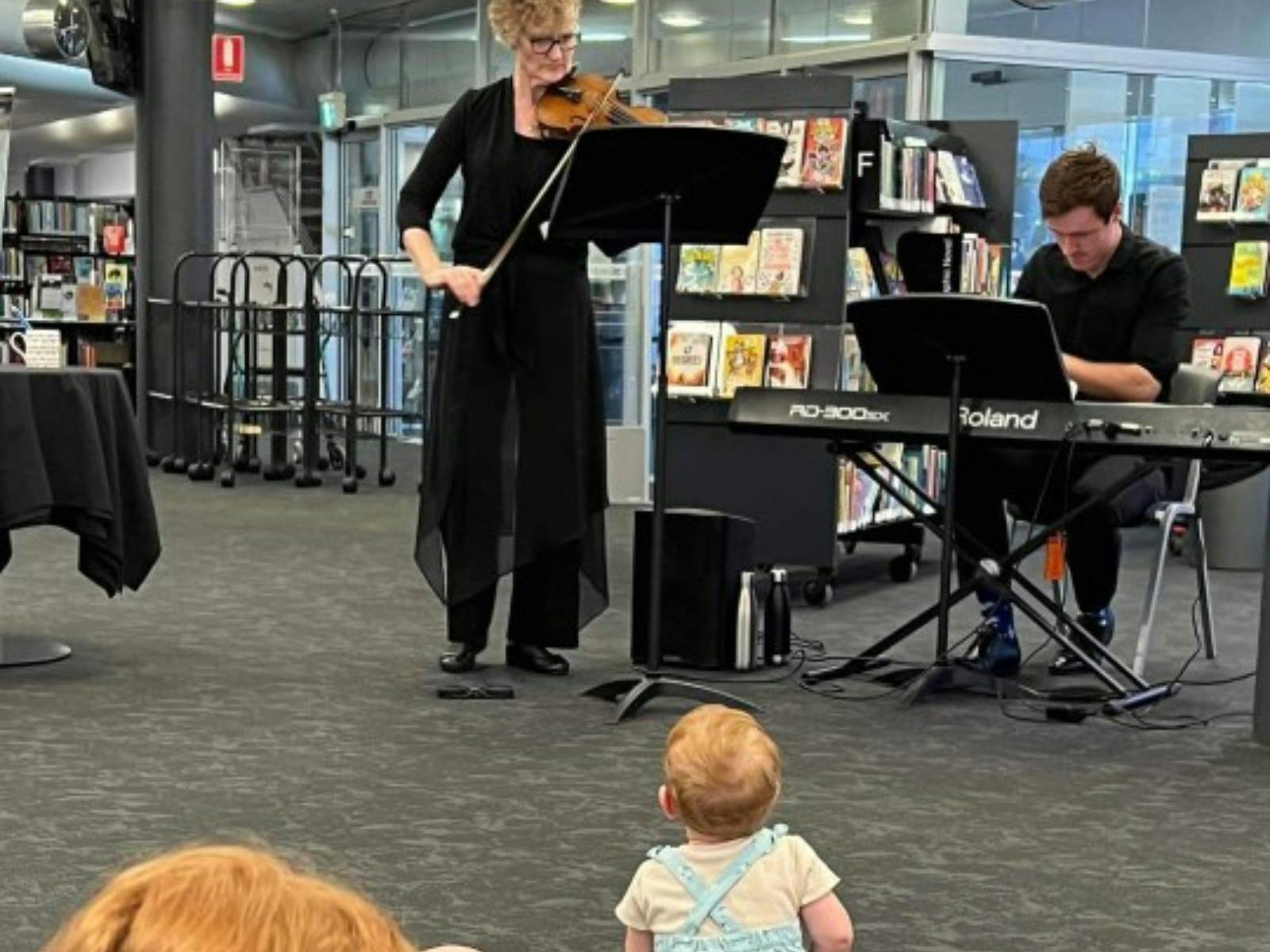 a performer is observed by a toddler