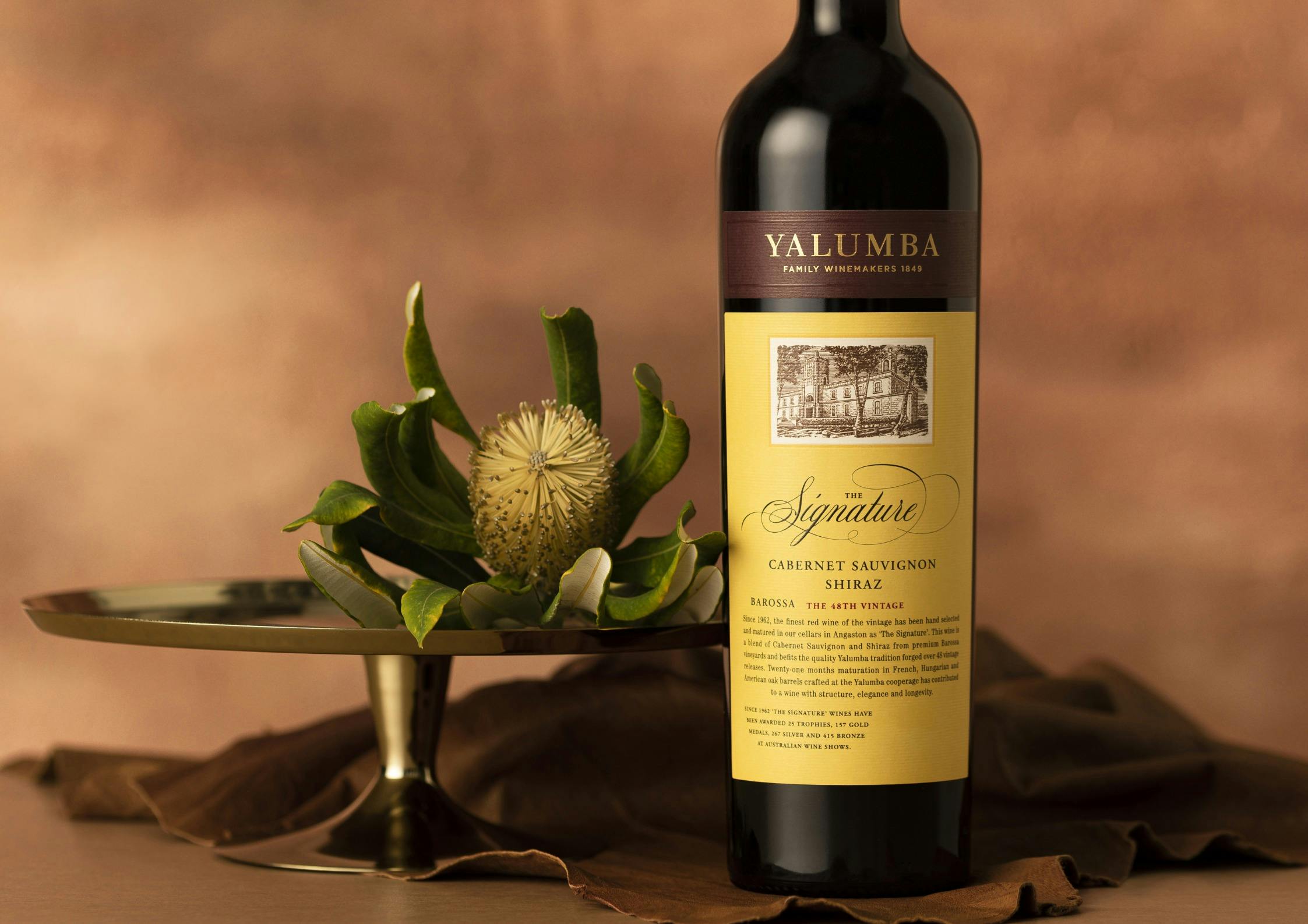 A bottle of Yalumba the Signature Wine Cabernet Shiraz with a yellow label