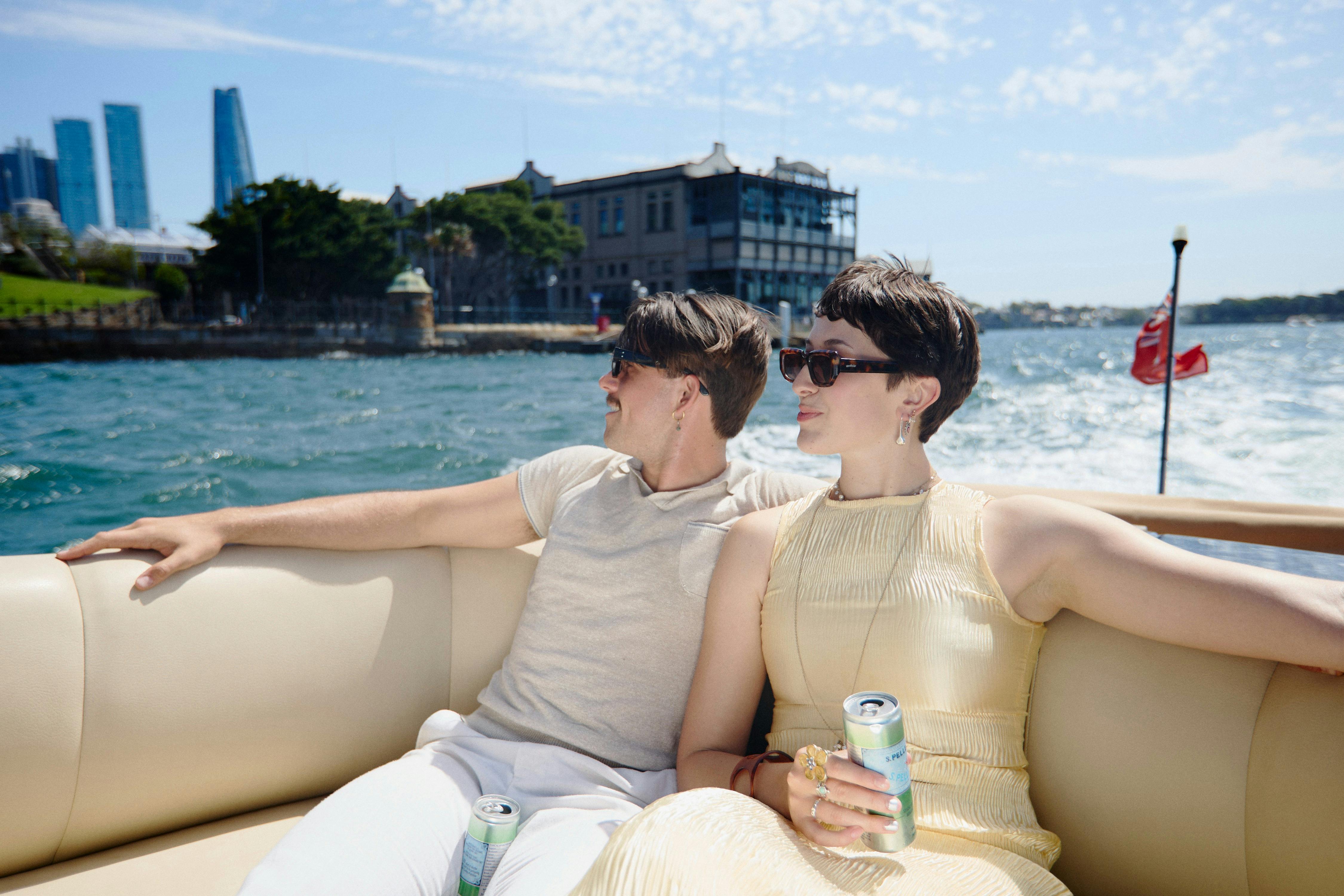Private boat tour on MV Aquamajestic cruising Sydney Harbour with city skyline views.