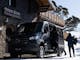 Double Black Alpine passenger van delivering guests to their accommodation in the snow.