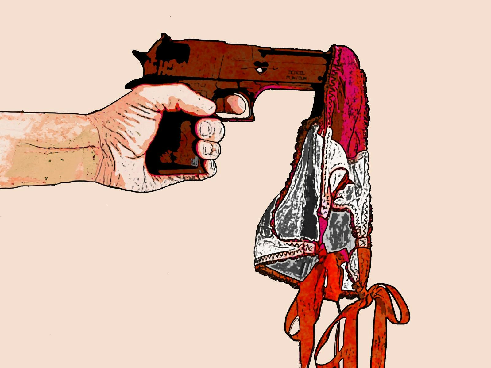A hand that is holding a firearm with fabric over it