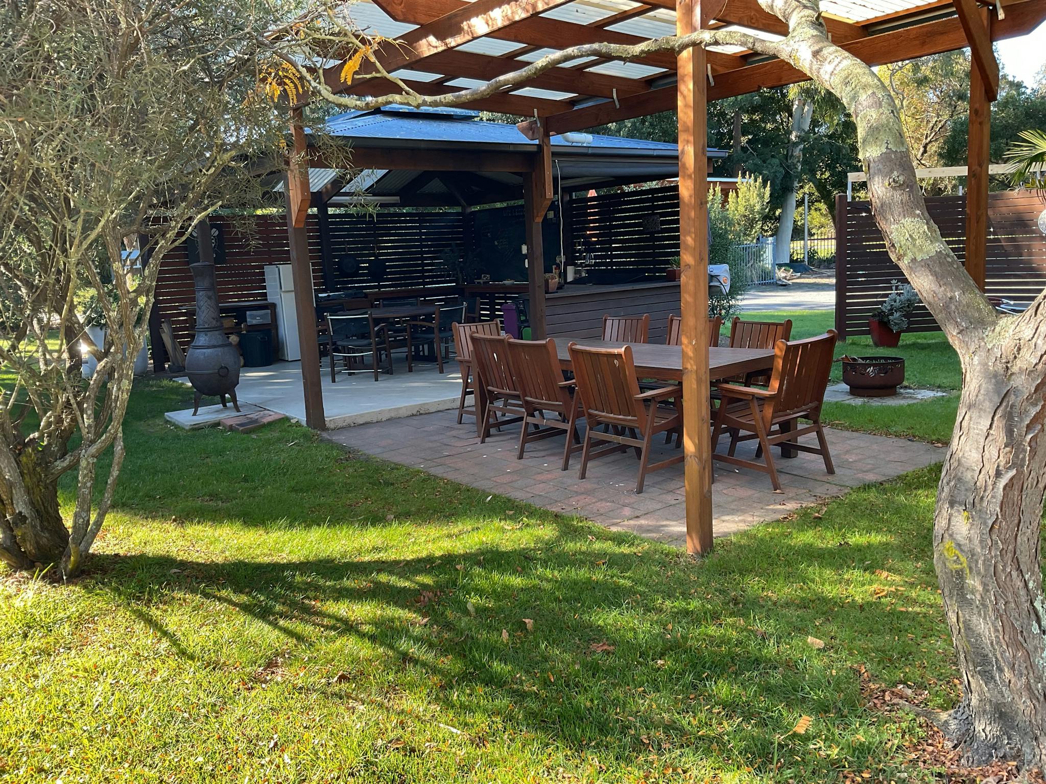An outdoor BBQ area with a dining area.
