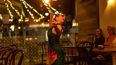 Burlesque performer swallowing fire