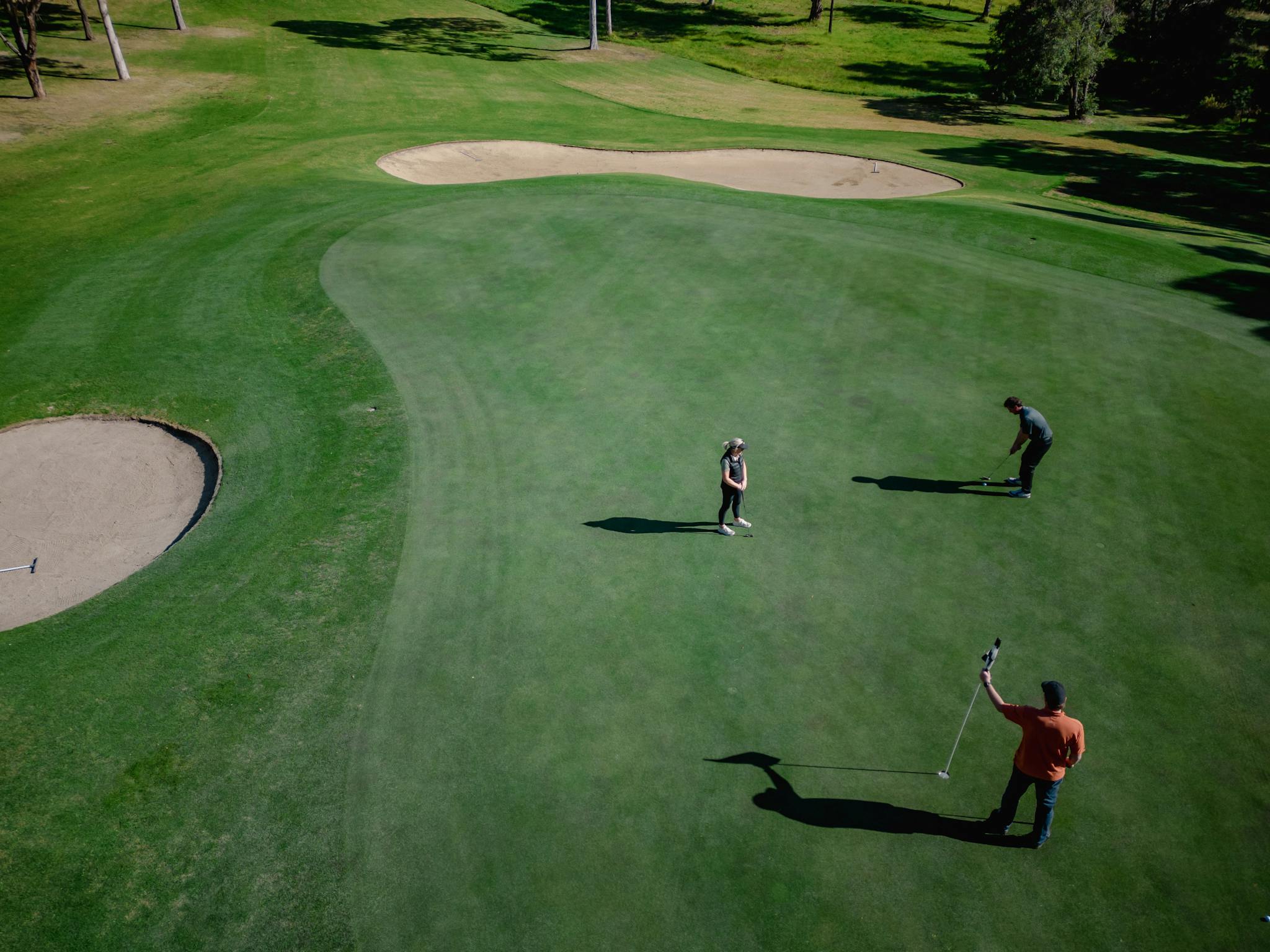 Aerial view of people playing golf at Metung Country Club