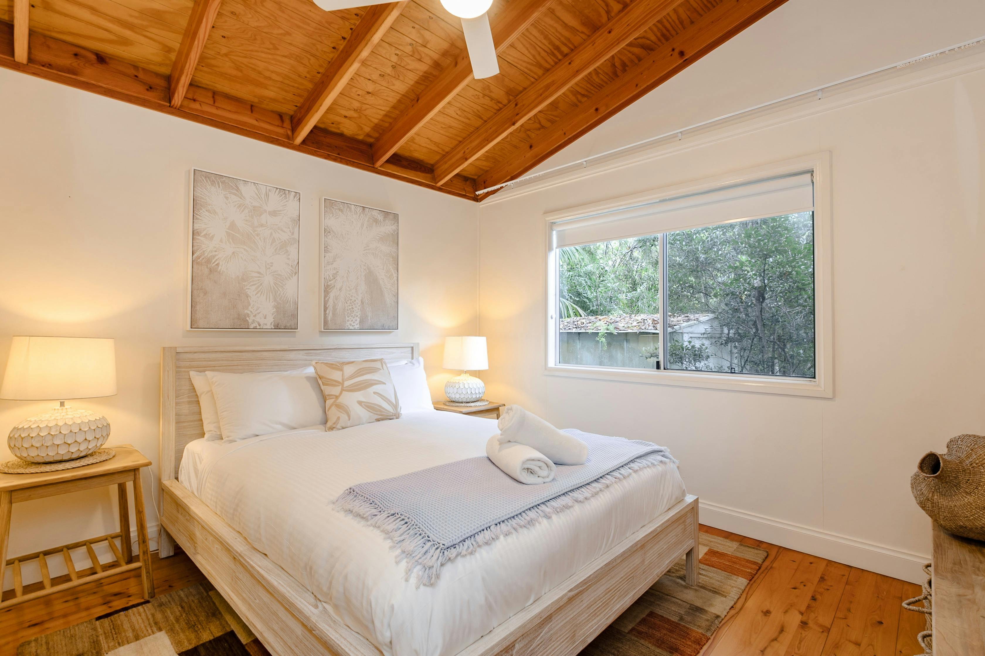 bedroom with white fresh linen and bedside tables