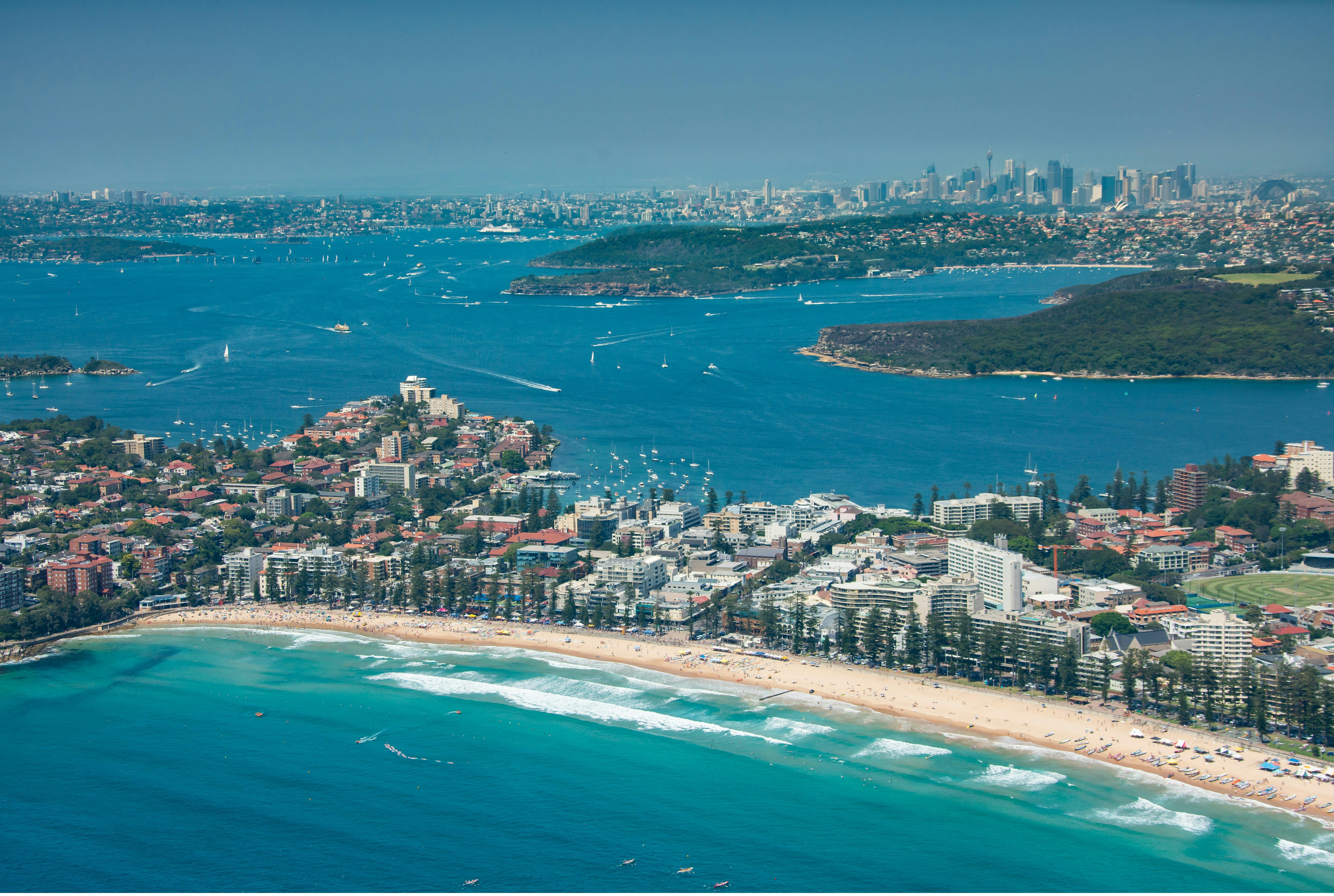 Aerial of Manly with Sydney Harbour in the background.