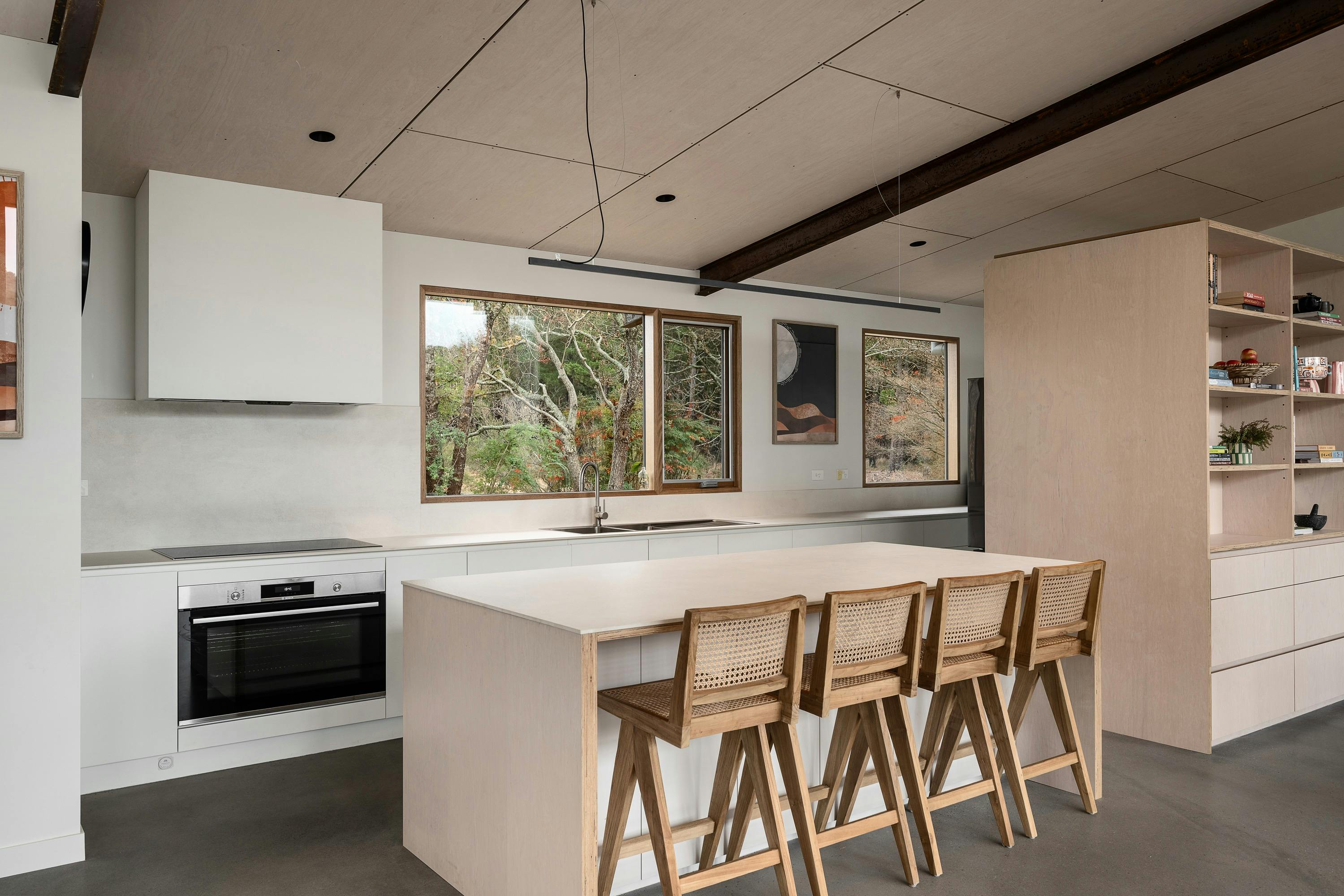silver house, 218 mt buffalo road,  kitchen with a kitchen island and four tall chairs and an oven