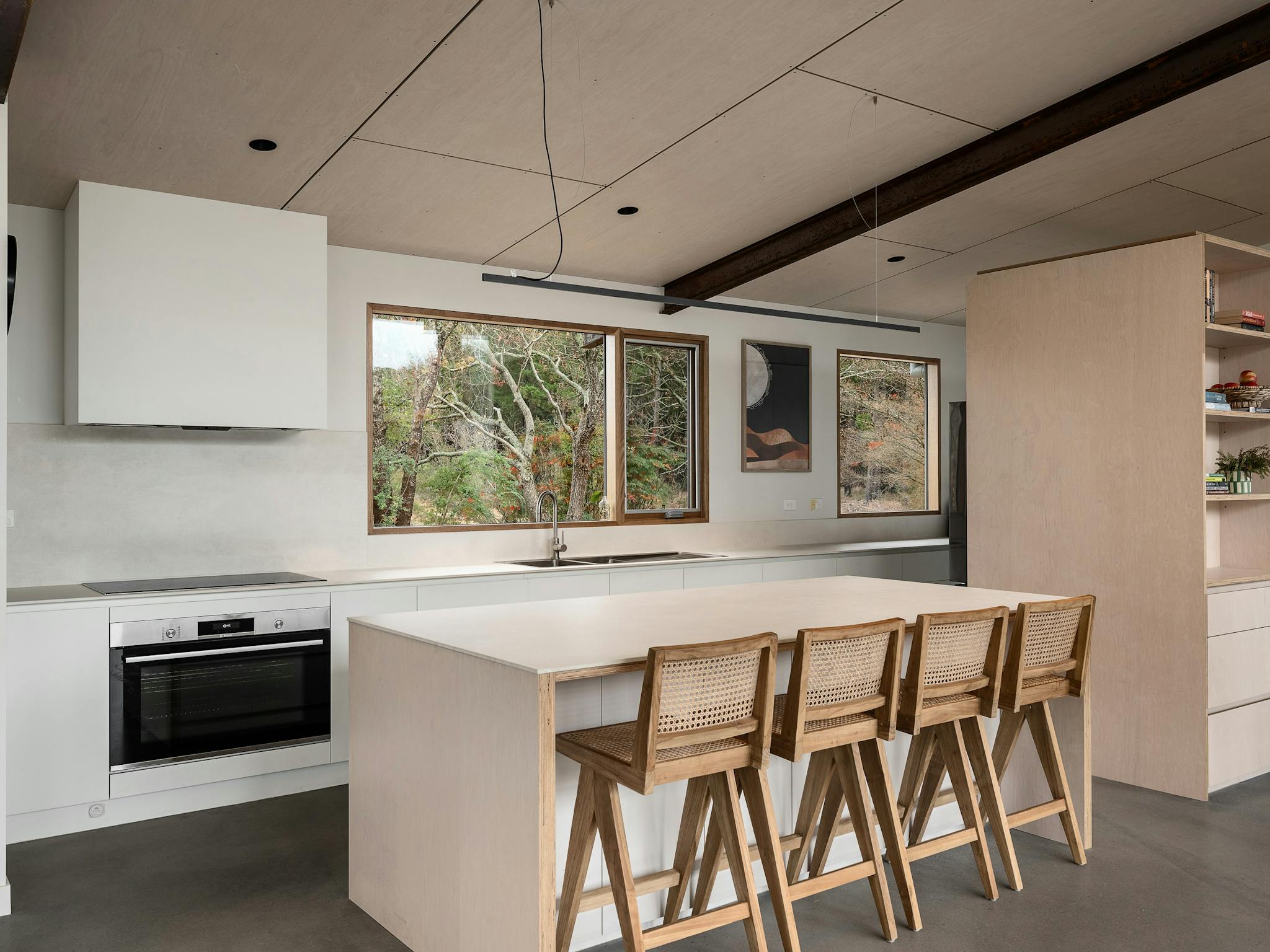silver house, 218 mt buffalo road,  kitchen with a kitchen island and four tall chairs and an oven