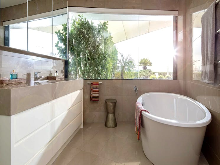 spa like en-suite also allows you to bath or shower taking in the stunning vista in complete privacy
