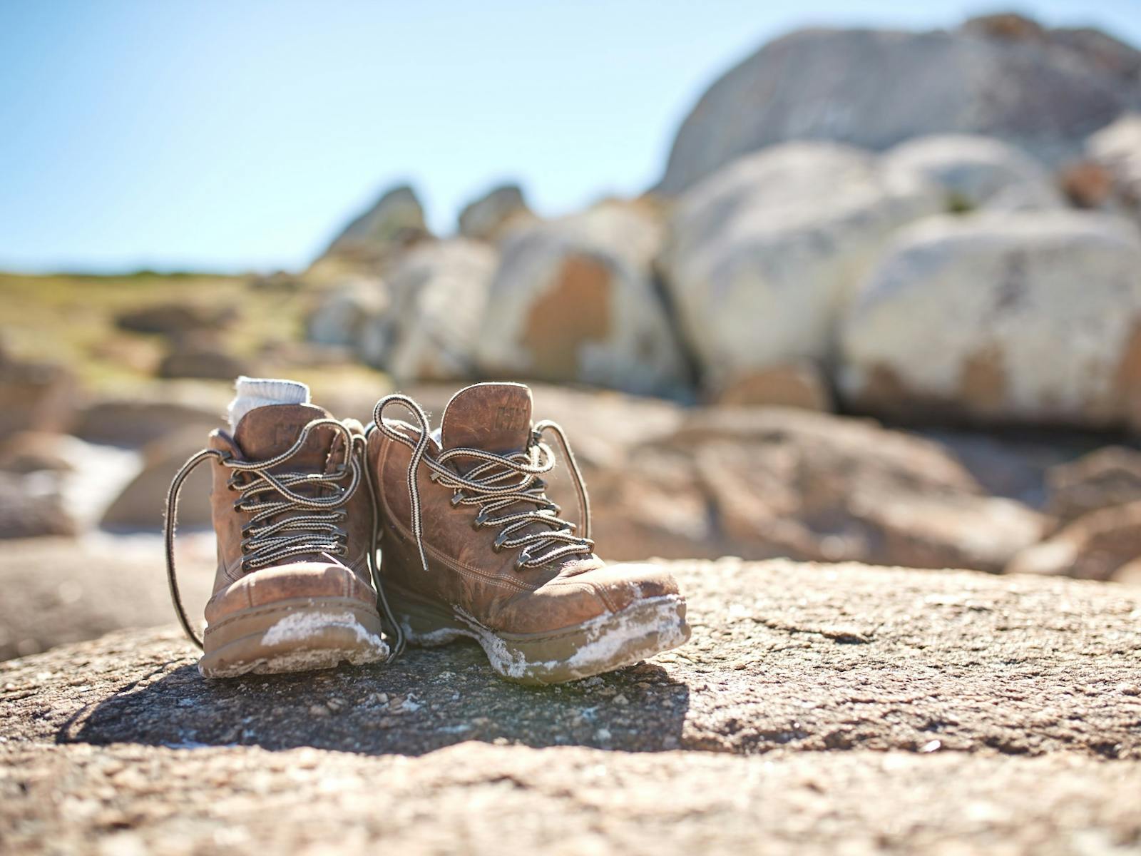 Hiking Boots on Granite Rocks Park Trek Walking Holidays Bay of Fires Hiking Tour