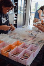 participants sorting through earring components for their creations