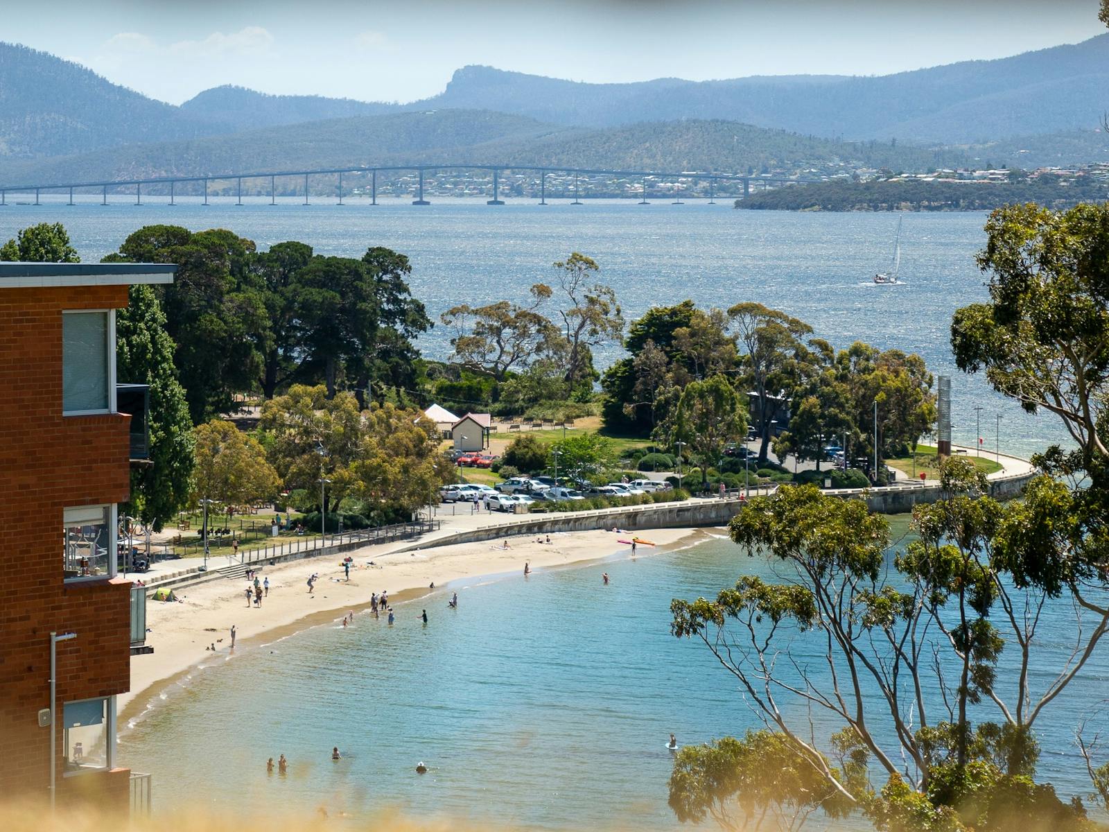 View of Long Beach, Lower Sandy Bay from Alexandria Battery with Derwent bridge in background.