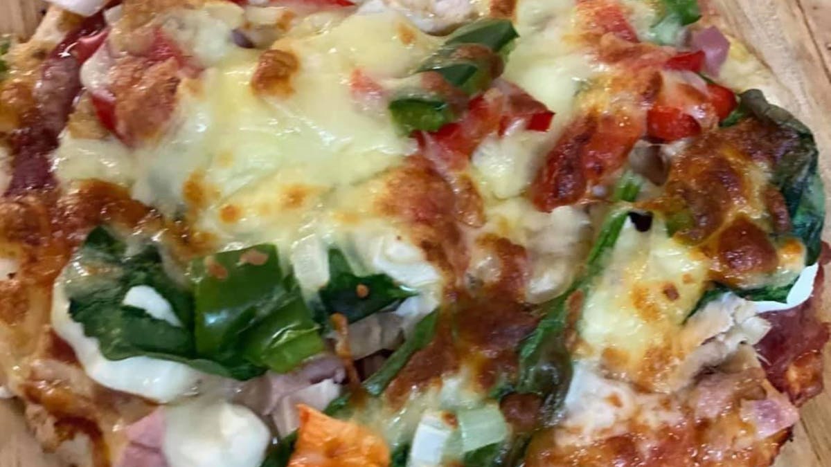 Freshly baked pizza available.