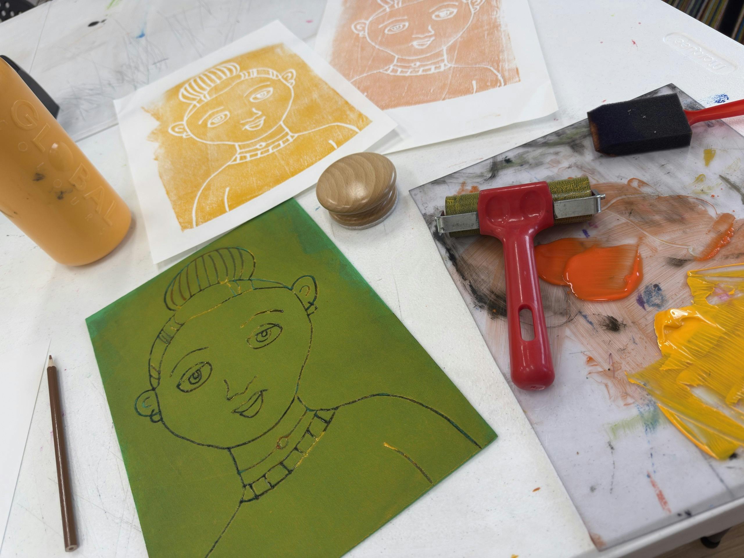 An array of printmaking materials showing relief print process
