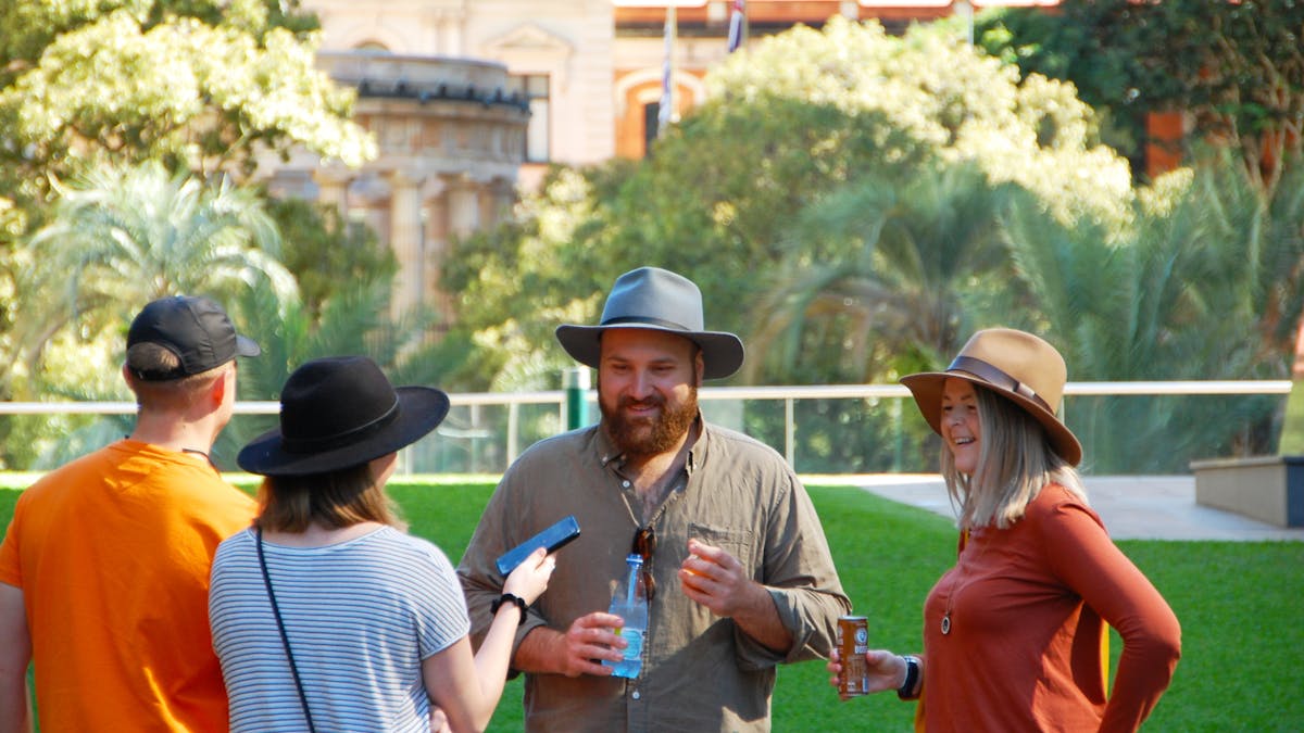Four people talking to each other outside
