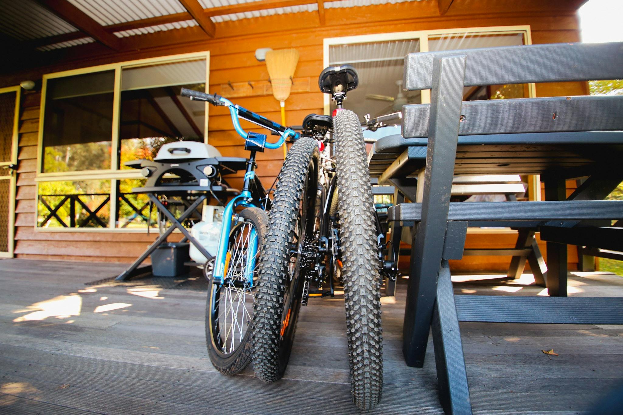 Image of veranda of Cabin with BBQ and guests bikes