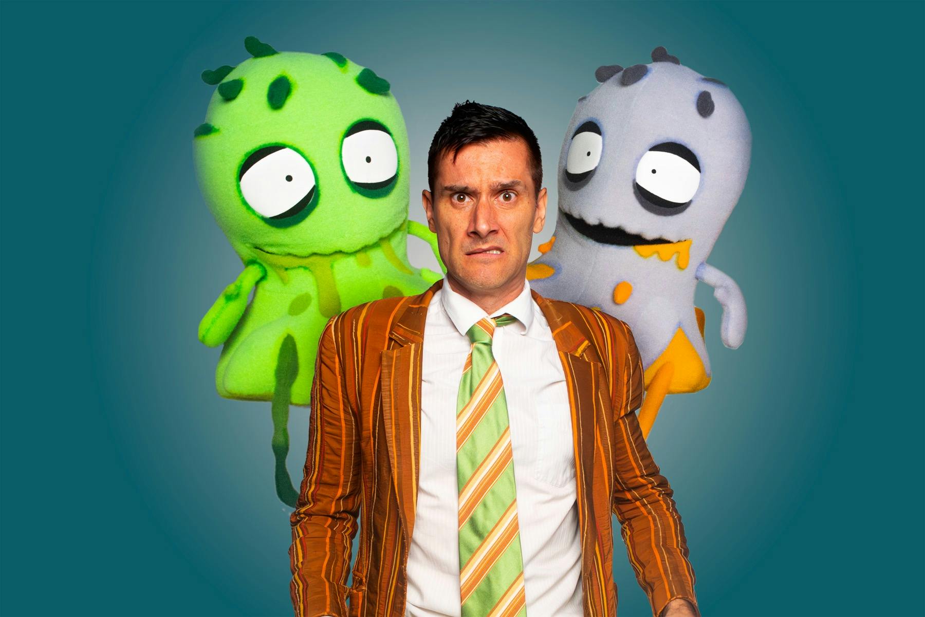 scared man with two zombie-booger puppets behind him