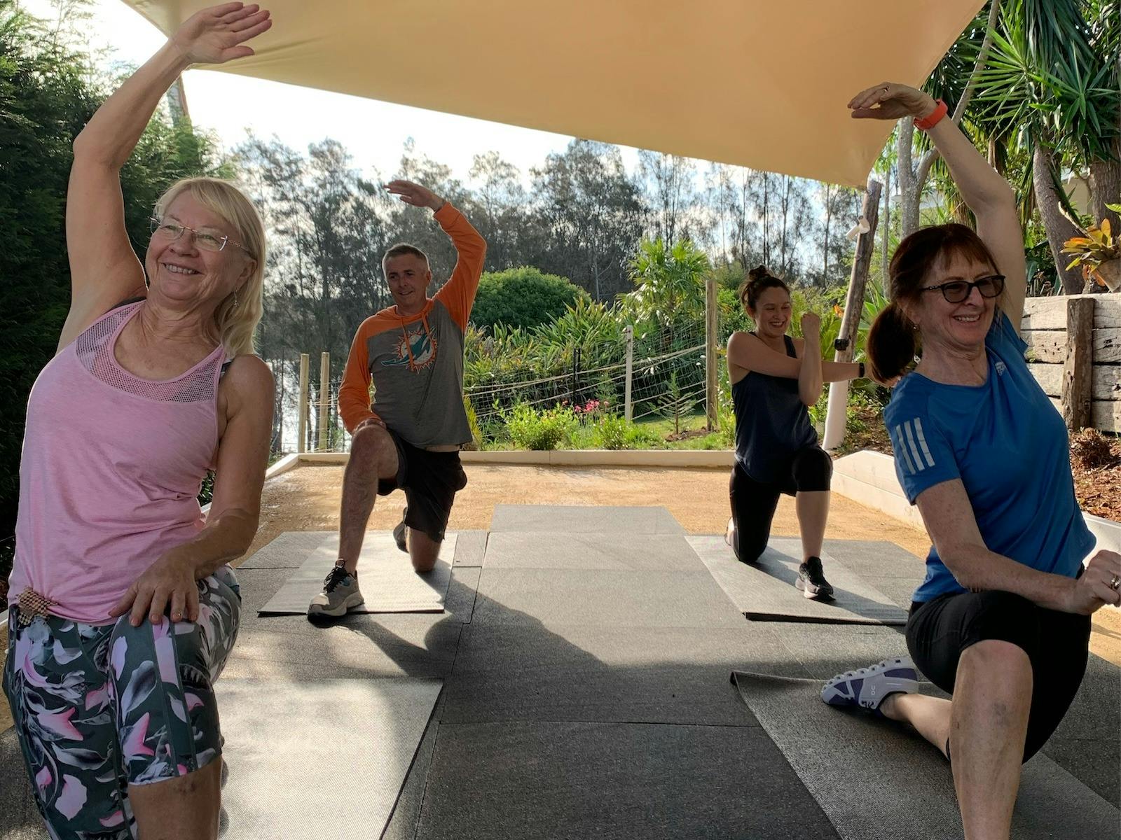 Group doing a stretch class at a fitness retreat