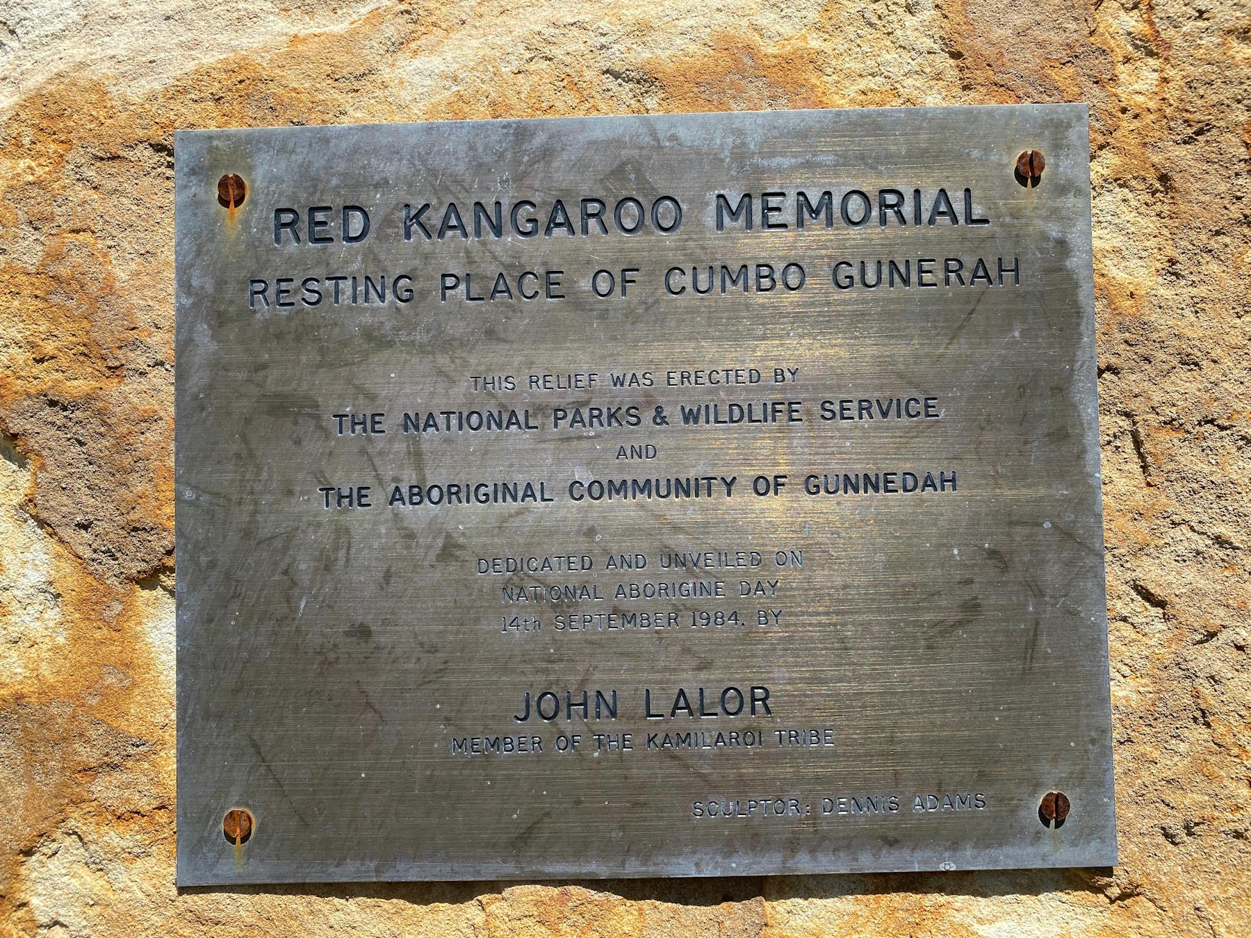 Bronze Plaque with writing on it telling the Red Chief Story