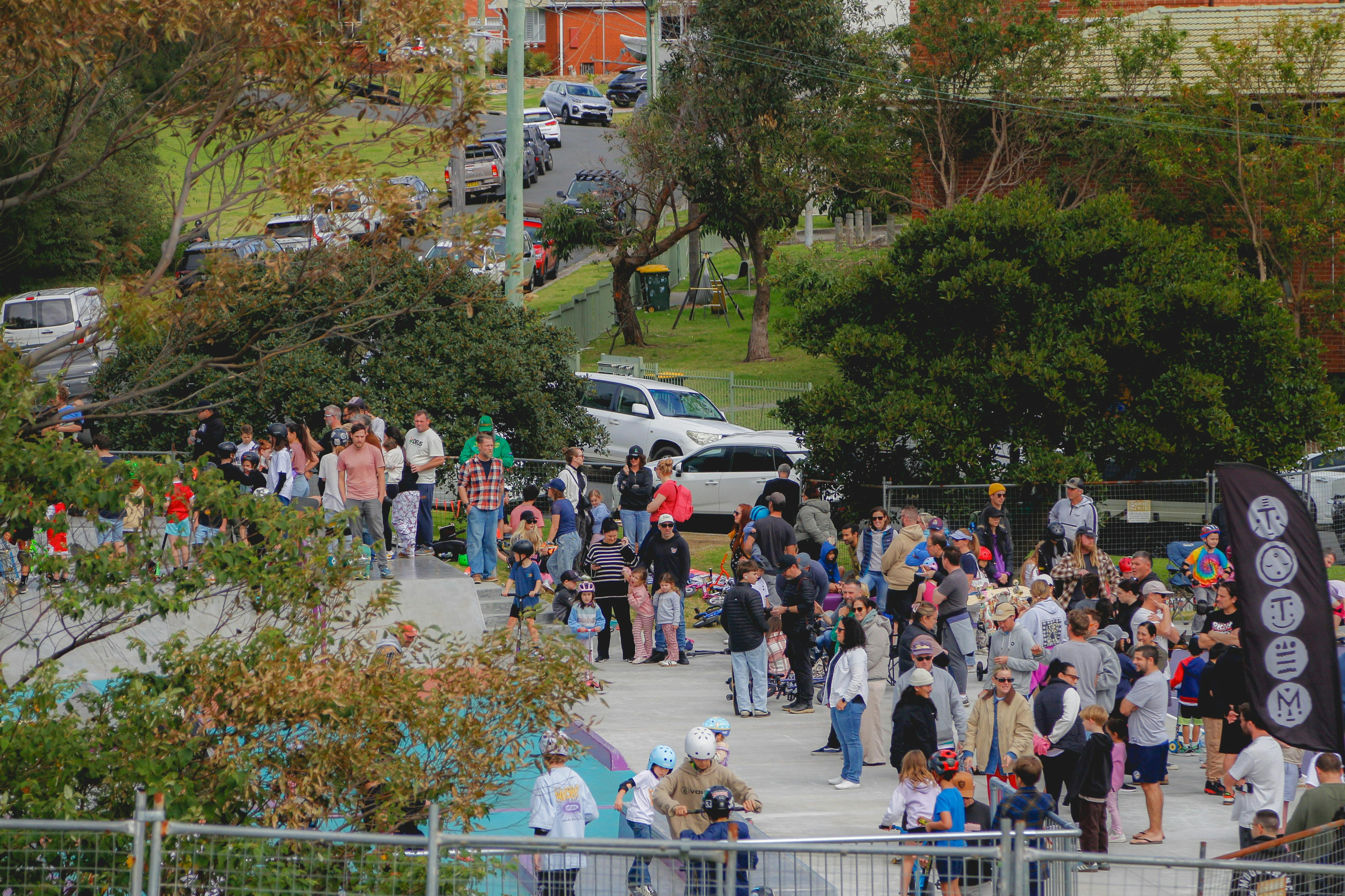 distant shot of a large crowd of families on a skatepark at port kembla