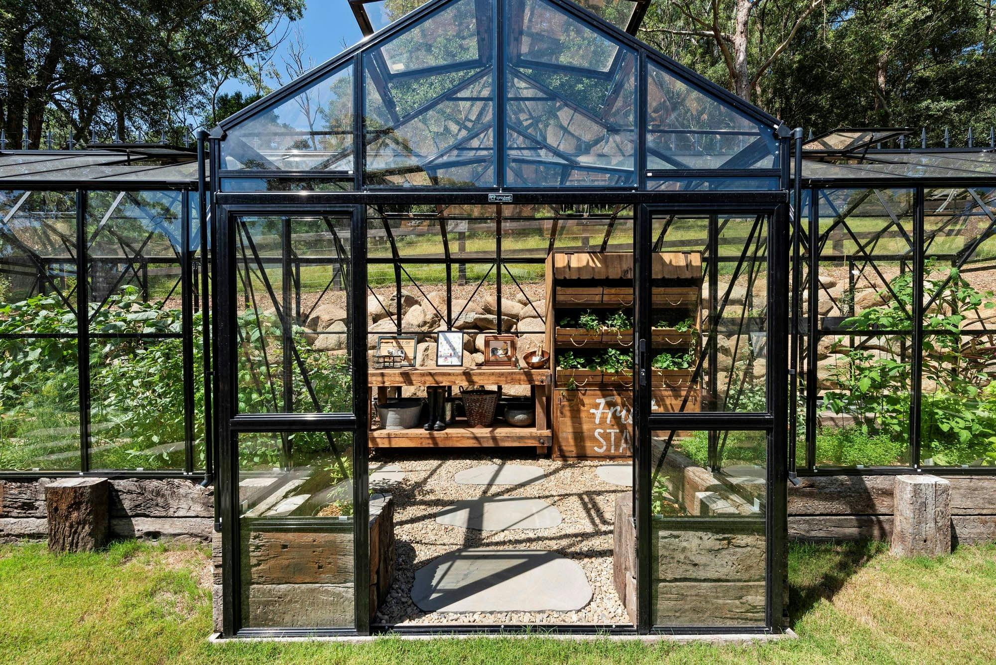 Glasshouse bursting with salad greens, herbs and seasonal produce