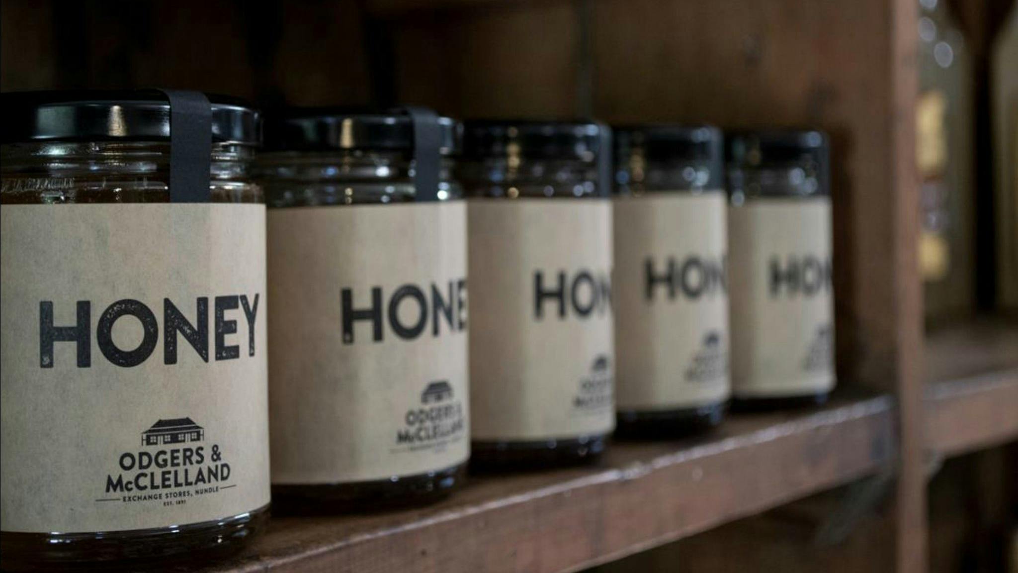 Local honey on original packing case shelving.