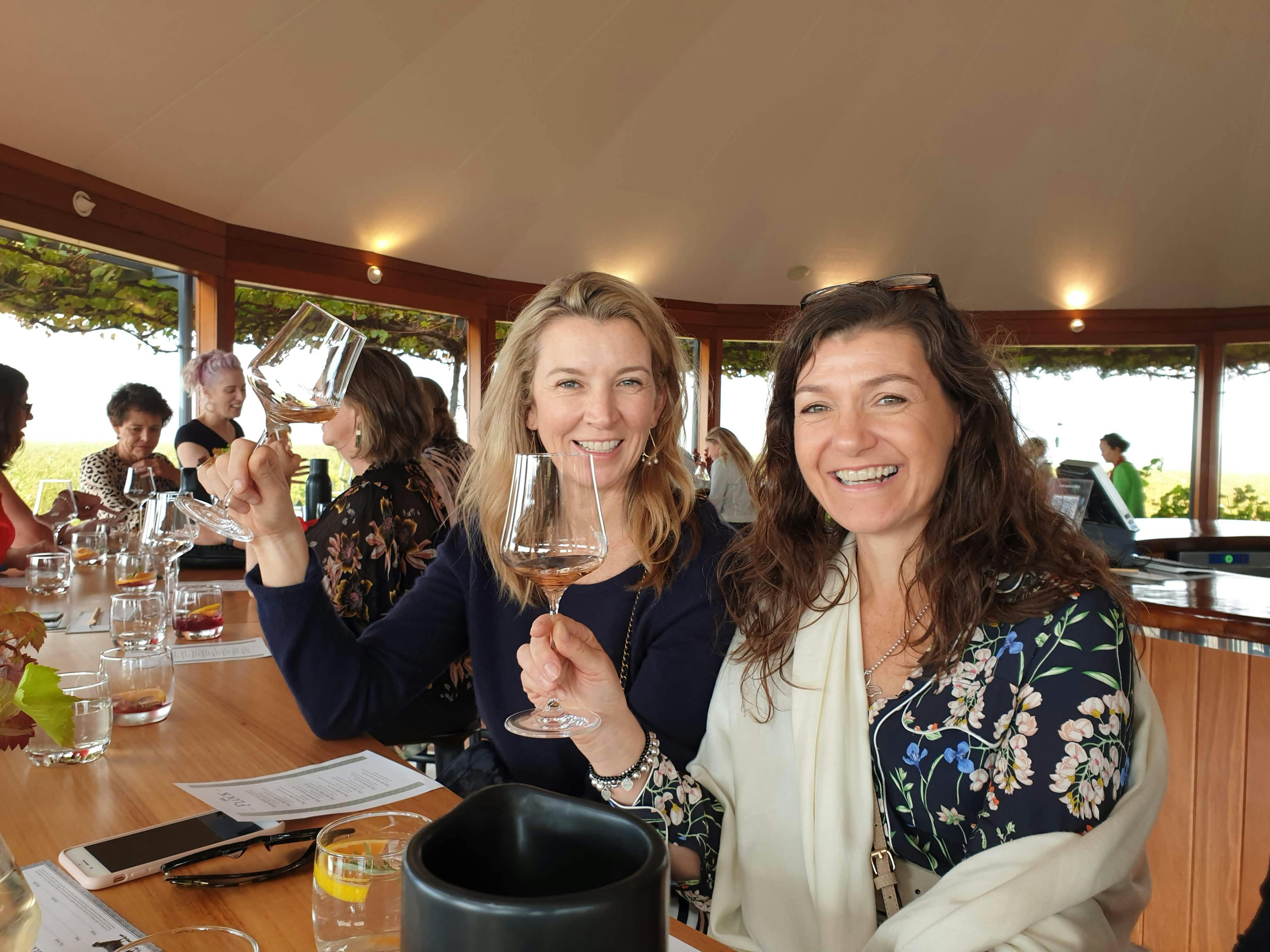 Two friends enjoying wine