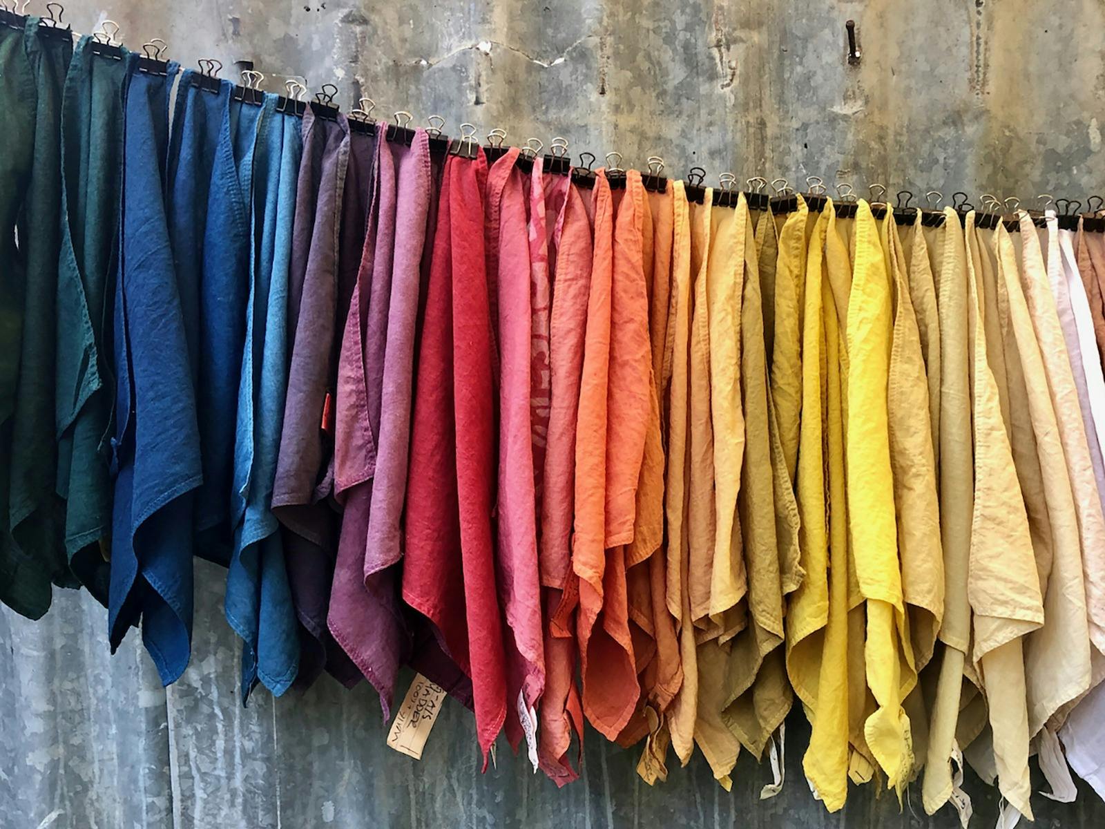 Various coloured fabrics hanging